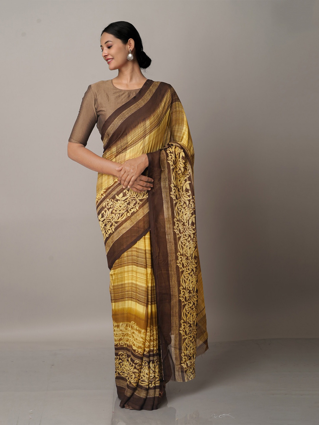 

Unnati Silks Brown & Yellow Floral Block Print Saree