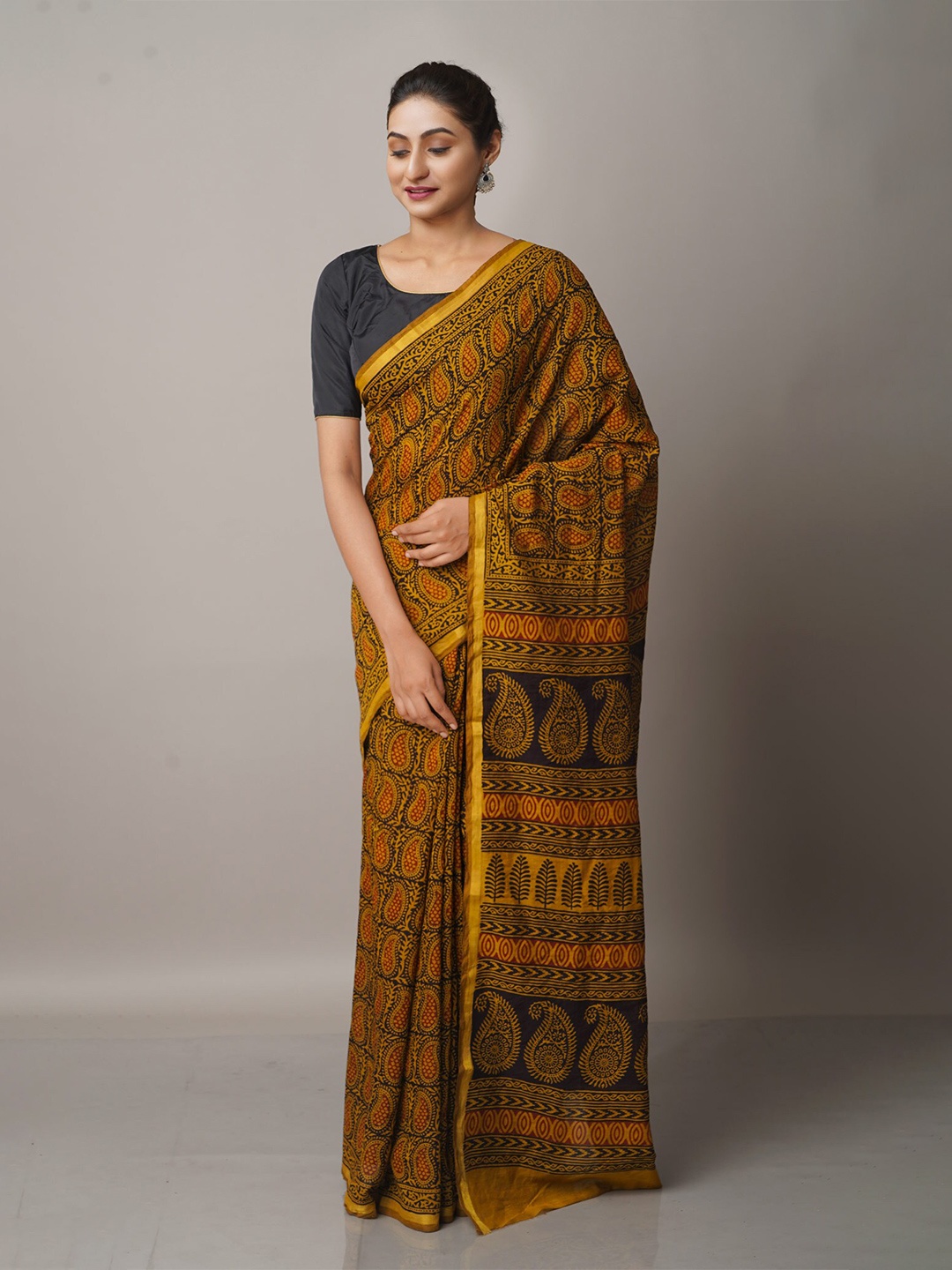 

Unnati Silks Mustard Yellow And Black Paisley Bagh Print Zari Chanderi Saree