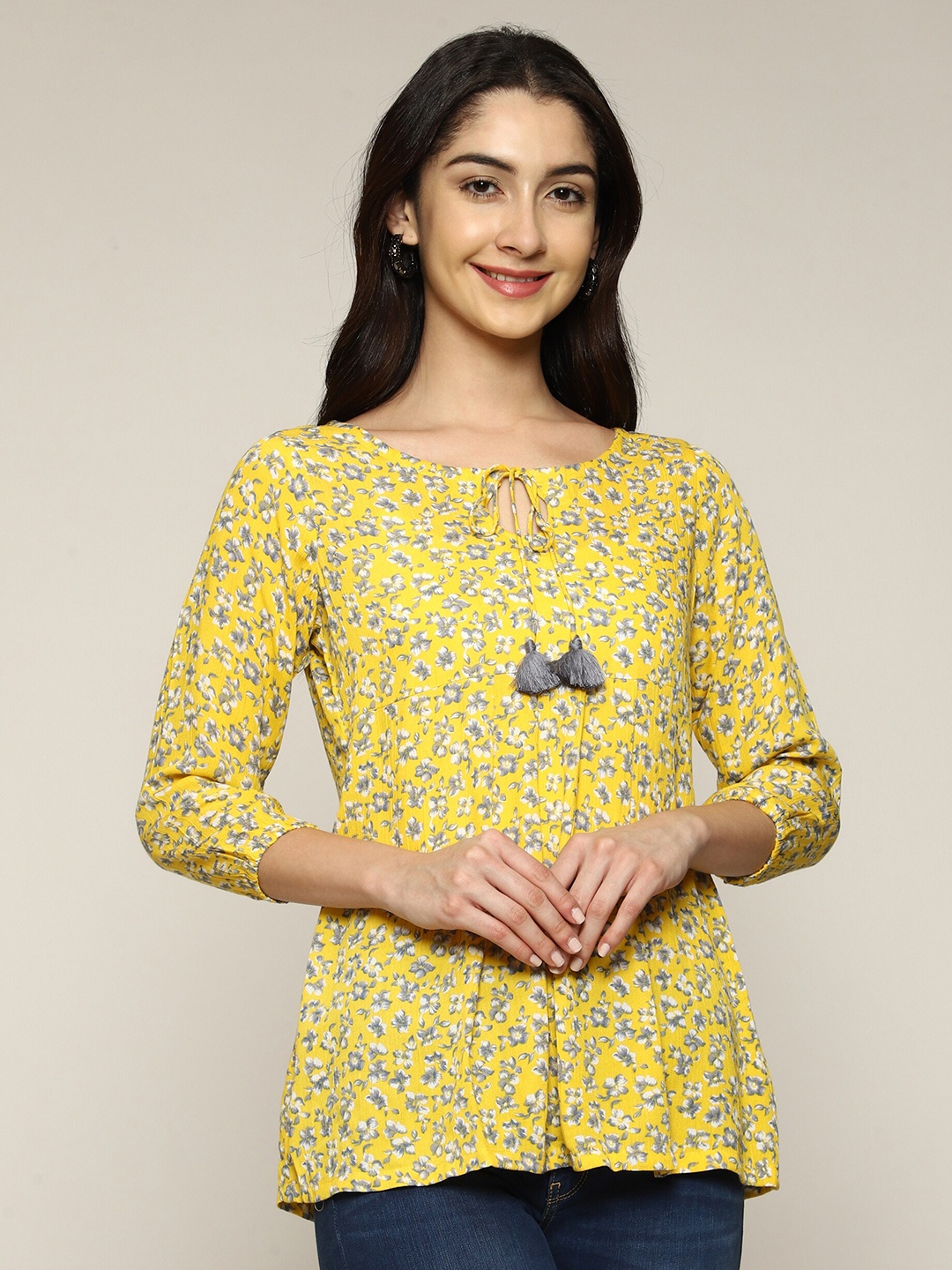 

Anuthi Yellow Floral Print Tie-Up Neck Top