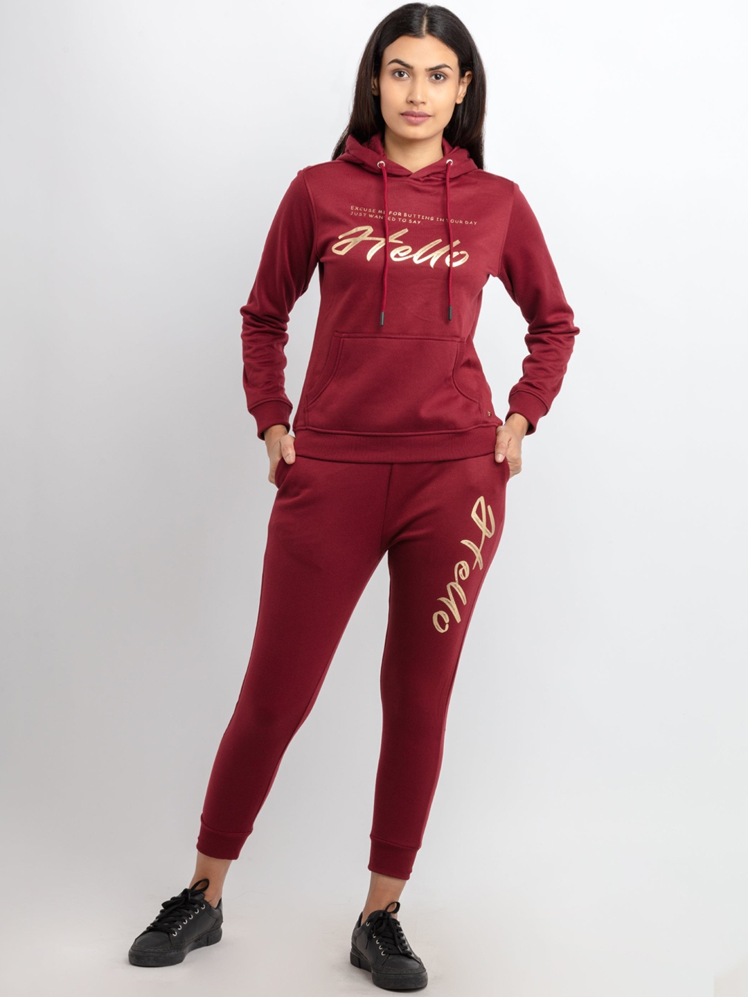 

Status Quo Women Maroon & Beige Solid Tracksuits