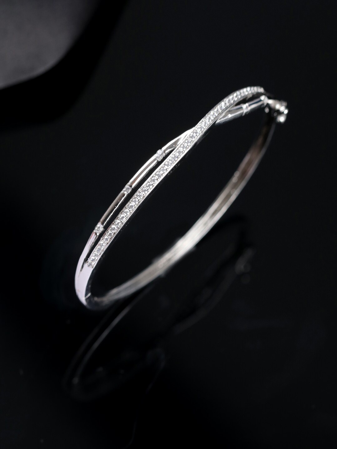 

Jazz and Sizzle Women Silver-Toned Brass American Diamond Silver-Plated Bracelet