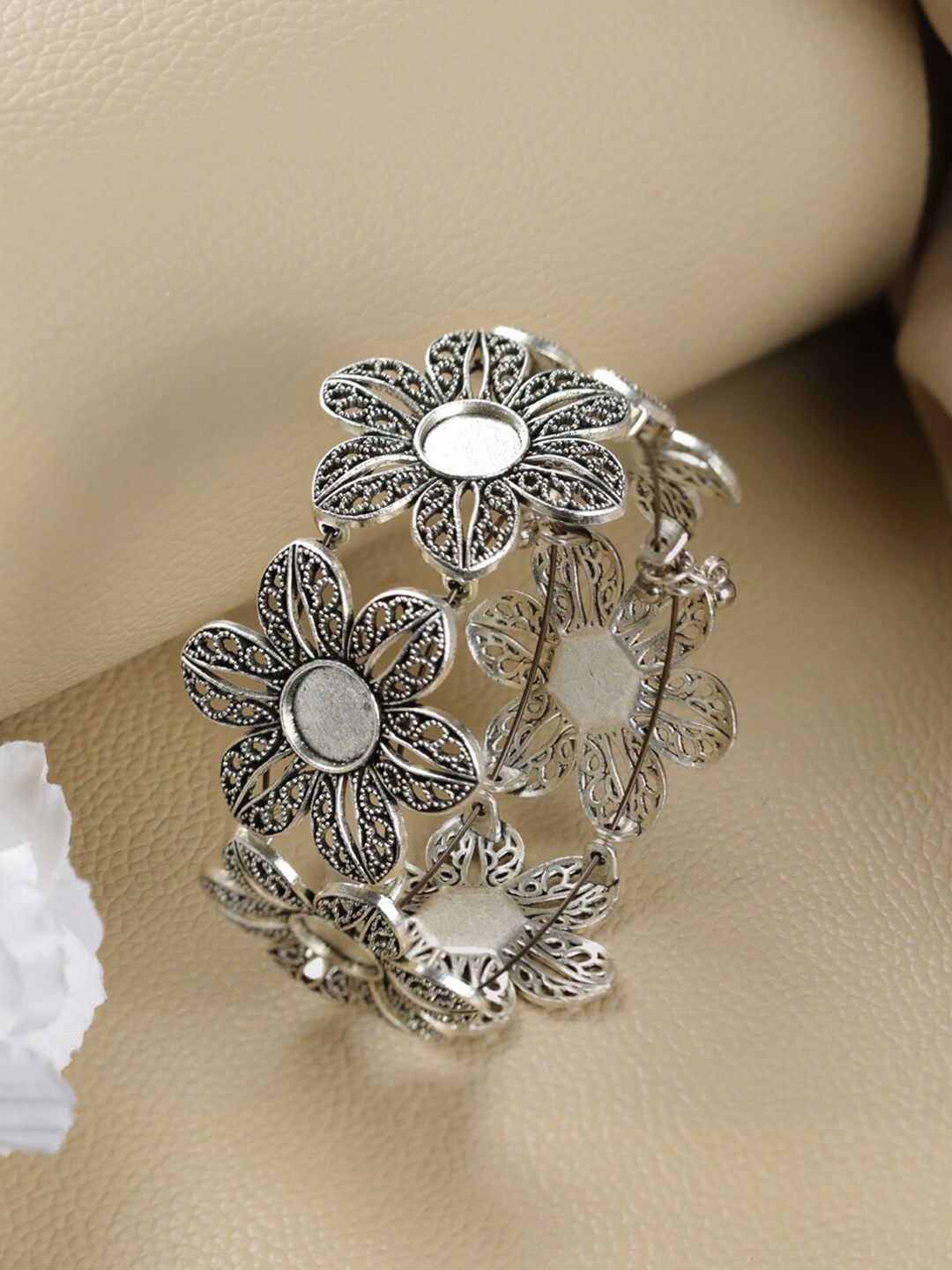 

Jazz and Sizzle Women Silver-Toned Brass Silver-Plated Bangle-Style Bracelet