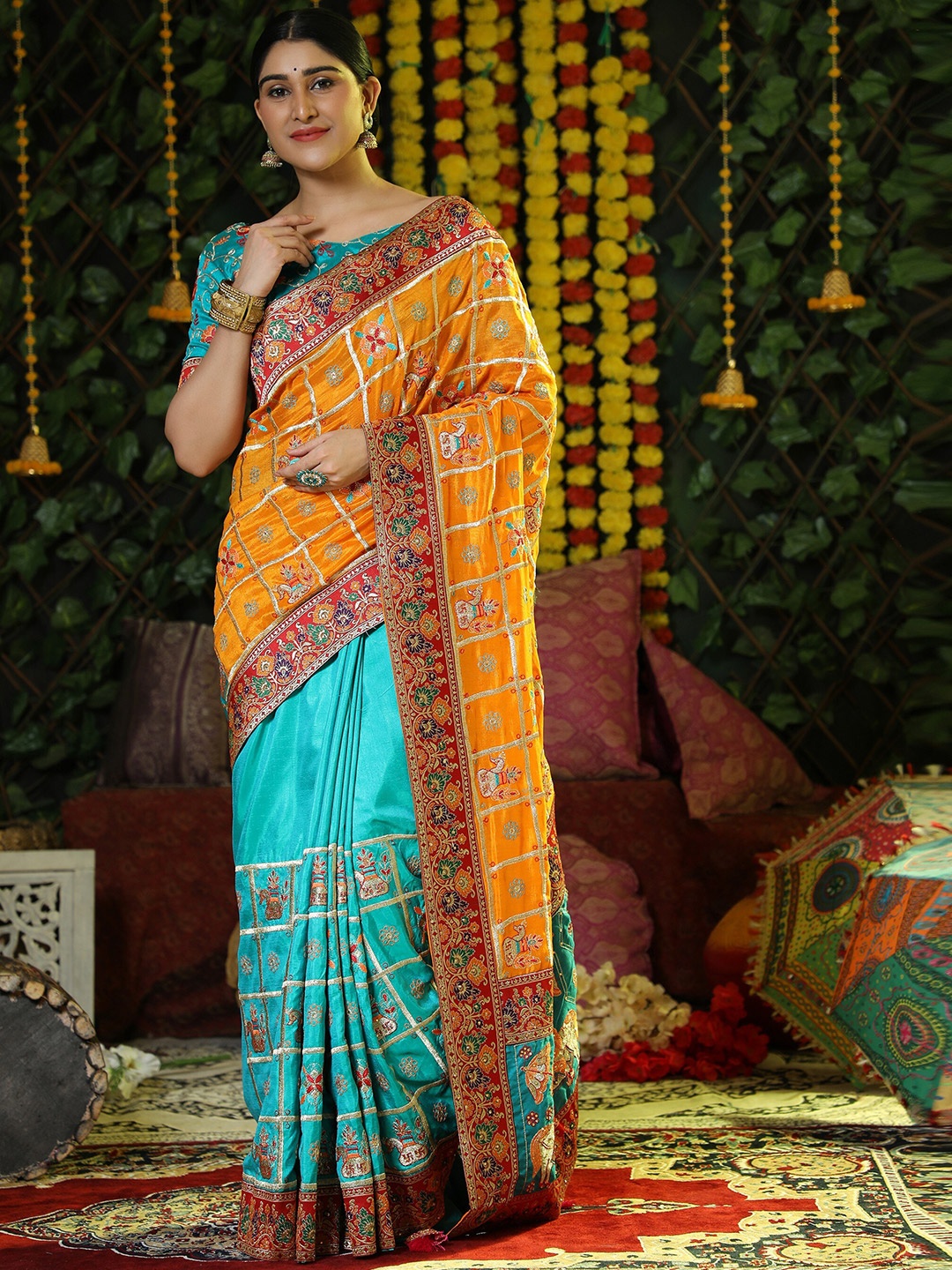 

ASPORA Orange & Blue Floral Embroidered Silk Blend Heavy Work Patola Saree