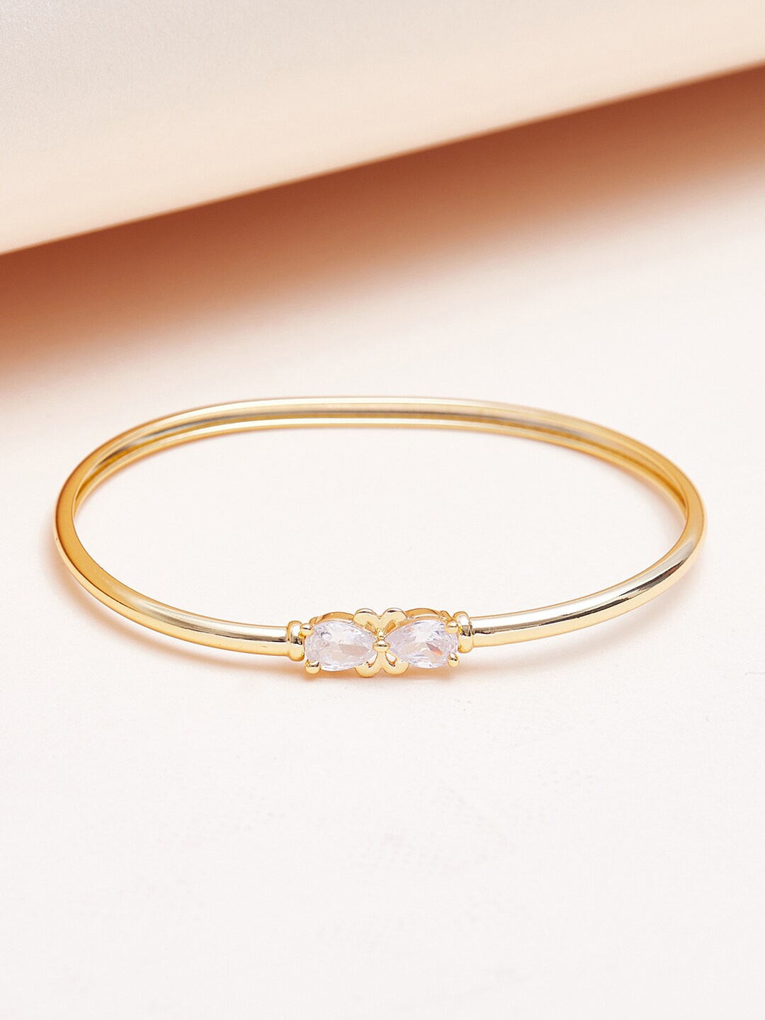 

Voylla Women Gold-Toned & White Brass Cubic Zirconia Gold-Plated Bangle-Style Bracelet