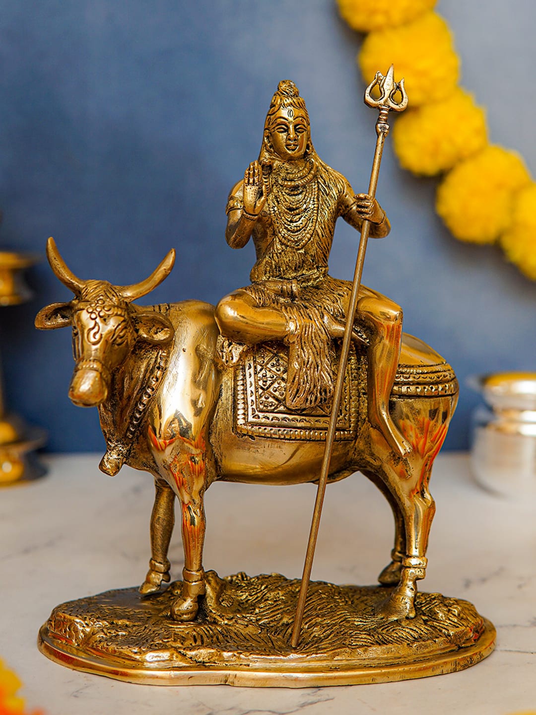 

StatueStudio Gold-Toned Shiva Statue Sitting On Nandi Savari Showpiece