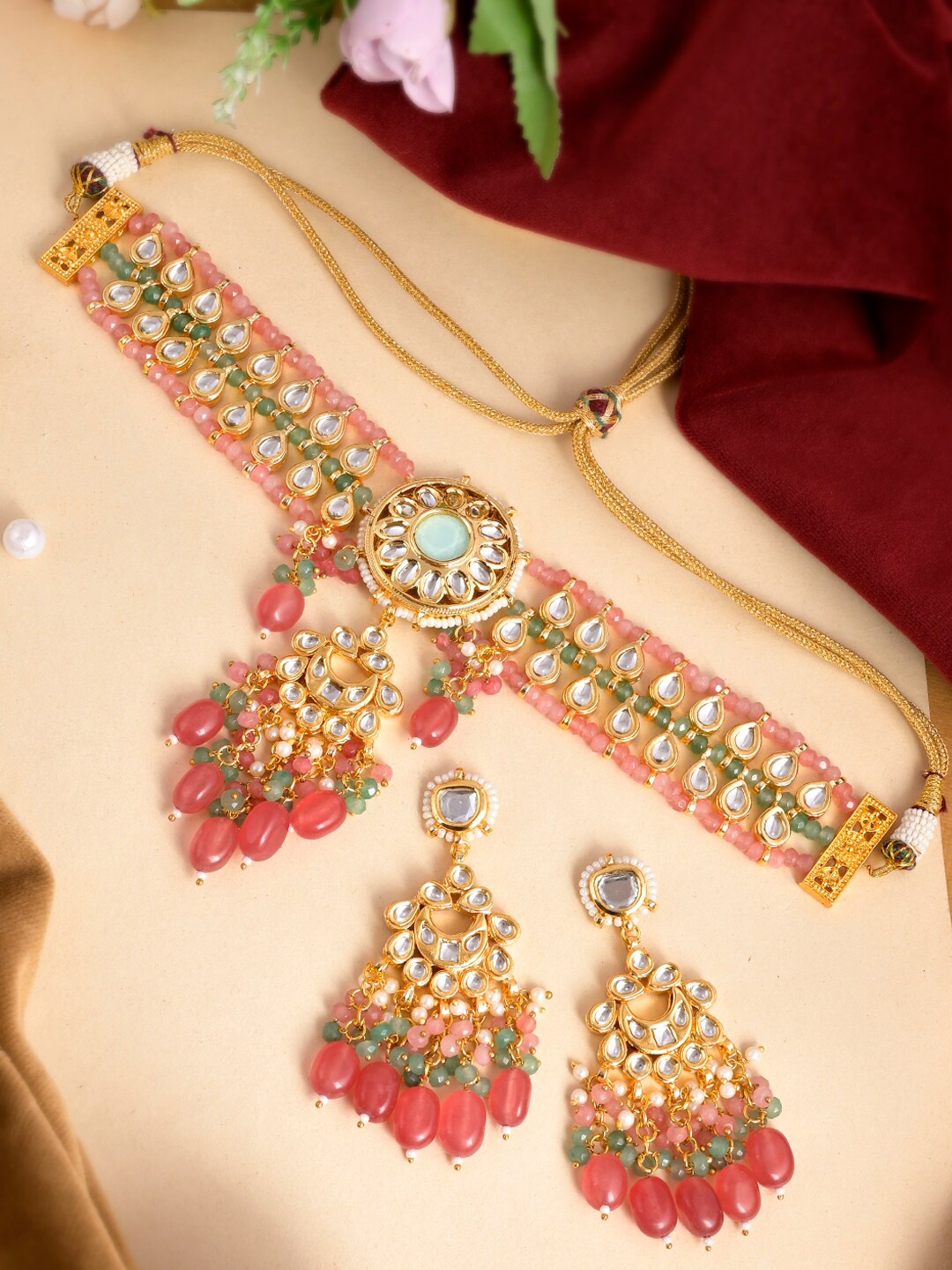 

DASTOOR Gold-Plated & Toned Red Kundan Studded Jewellery Set