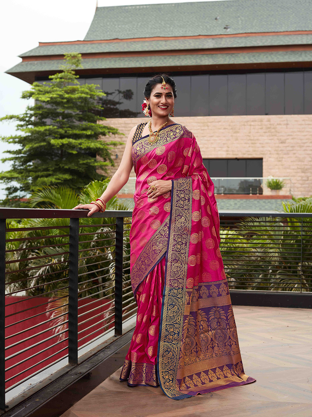 

Mitera Pink & Purple Ethnic Motifs Zari Silk Blend Kanjeevaram Saree