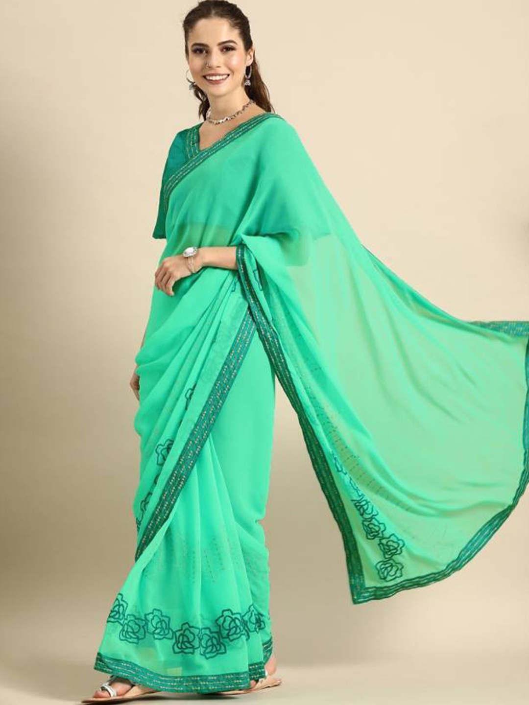 

Sangria Teal & Green Floral Zari Pure Georgette Saree
