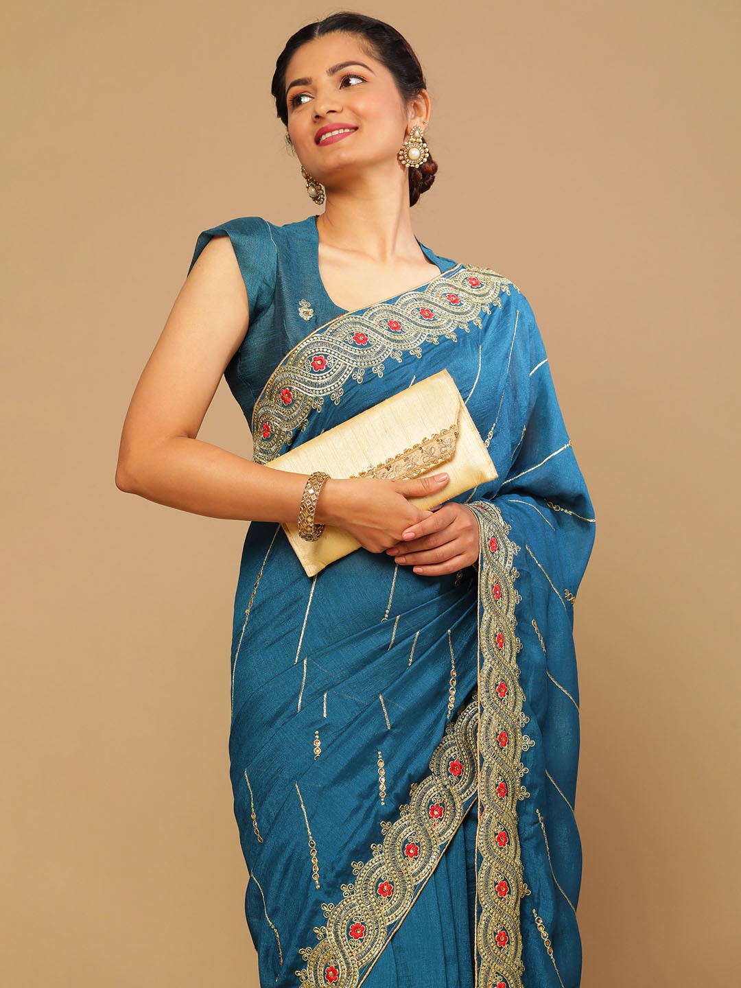 

Satrani Teal & Red Ethnic Motifs Zari Saree