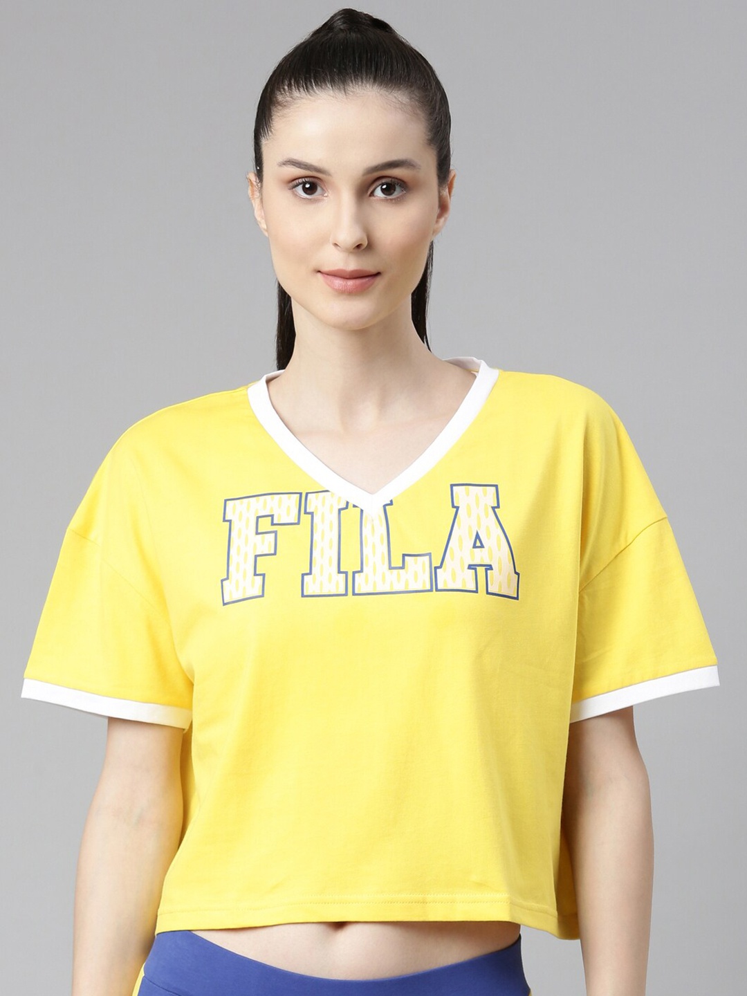 

FILA Women Yellow Typography Printed V-Neck Drop-Shoulder Sleeves Organic Cotton T-shirt