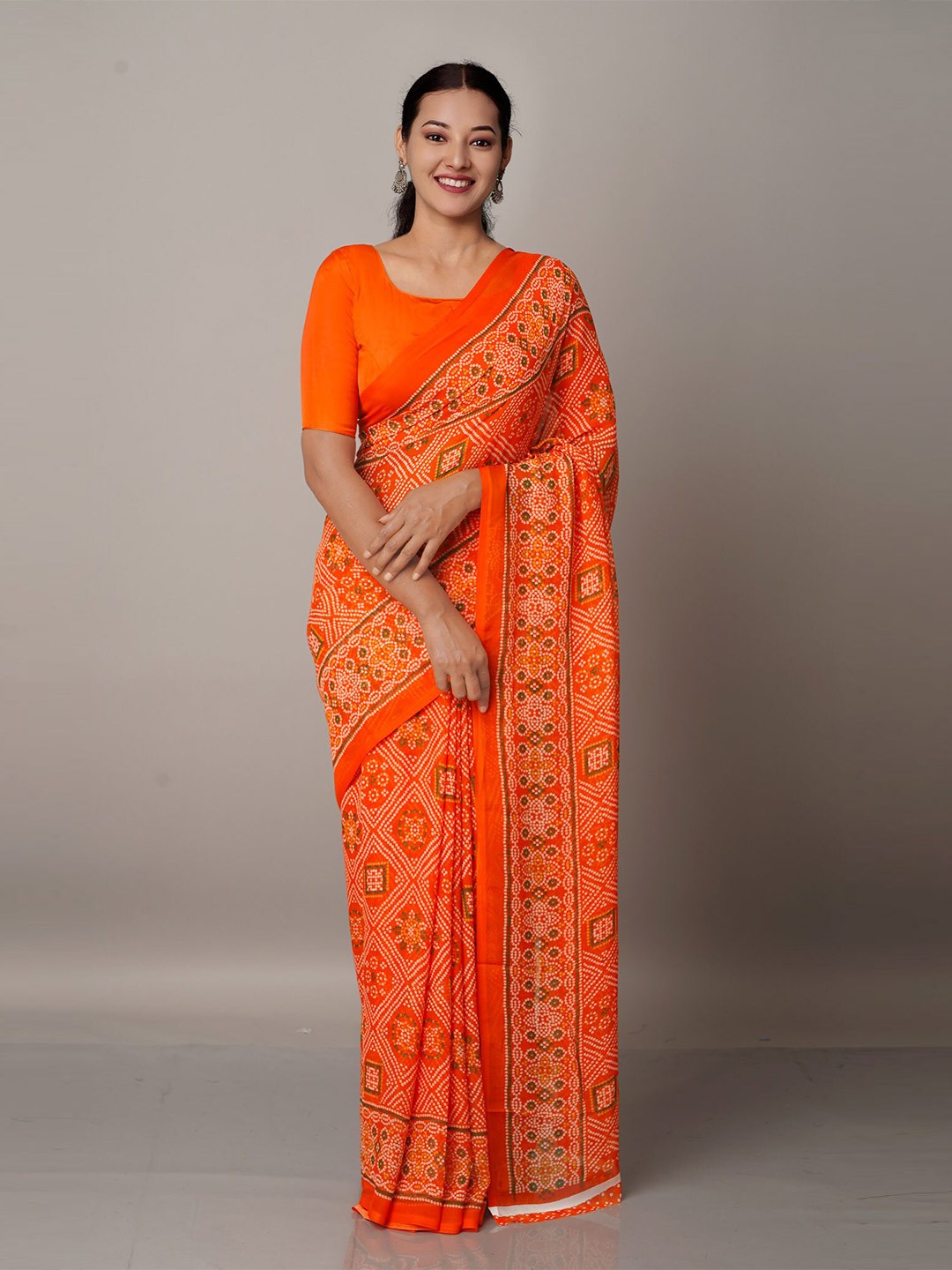 

Unnati Silks Orange Bandhani Georgette Block Printed Saree