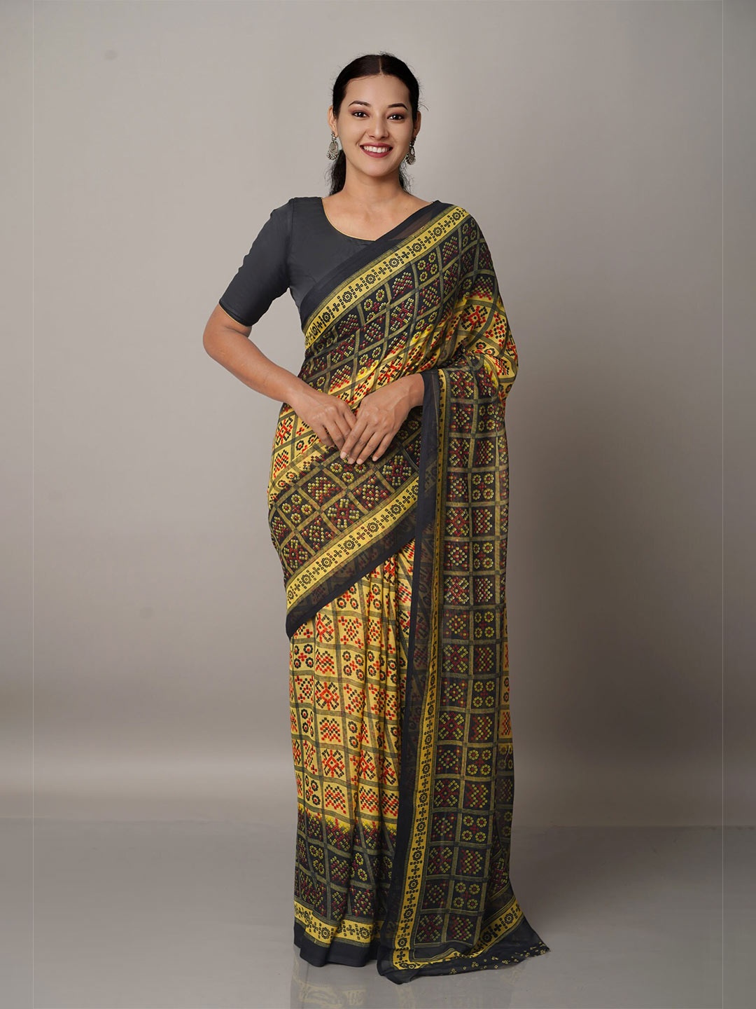 

Unnati Silks Green & Yellow Bandhani Georgette Block Printed Saree