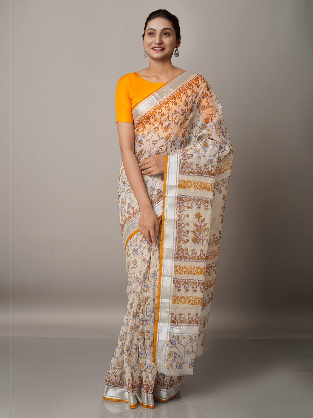 

Unnati Silks Cream & Orange Block Printed Zari Pure Cotton Kota Saree