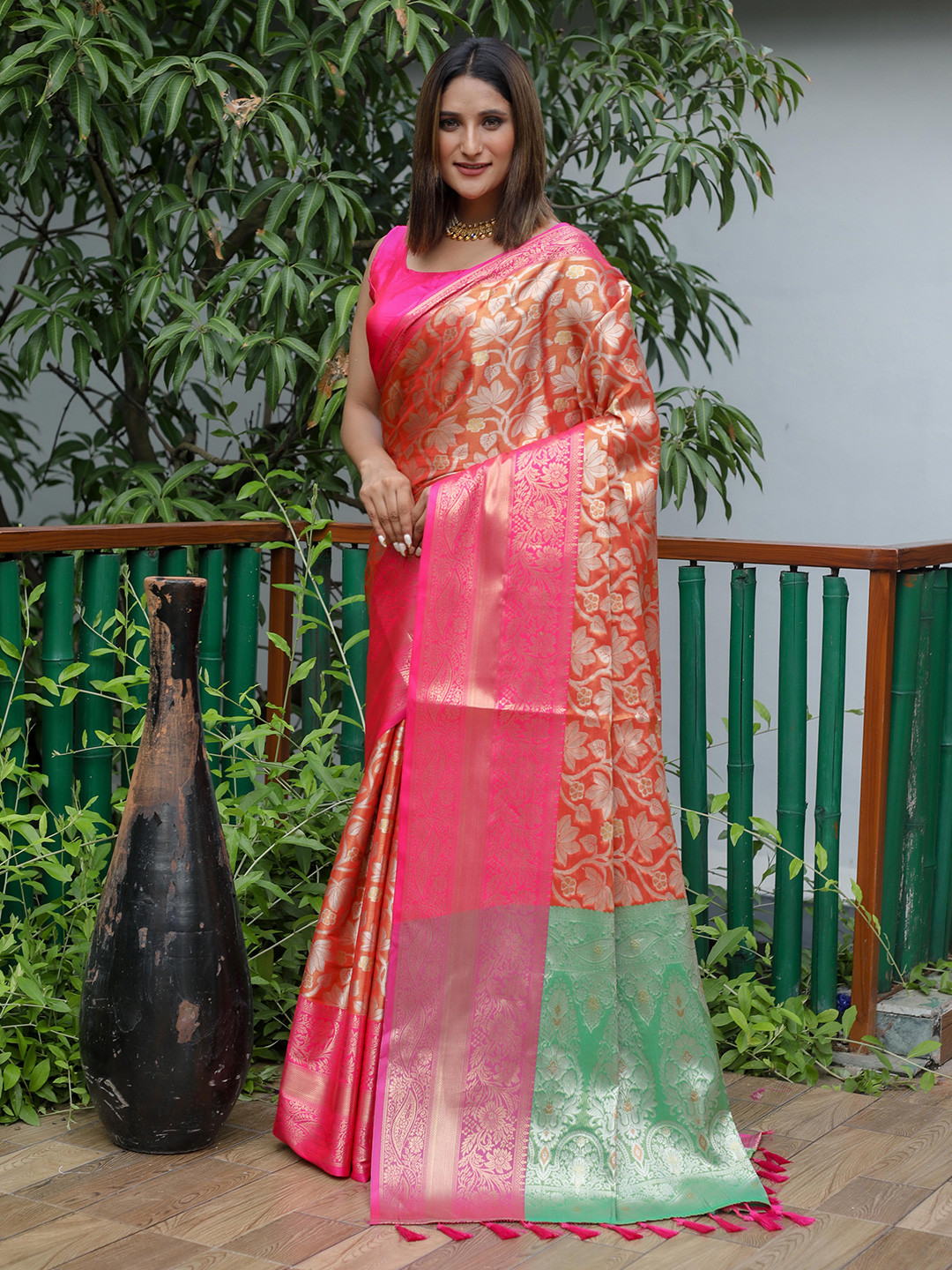 

Mitera Orange & Green Floral Zari Silk Blend Kanjeevaram Saree