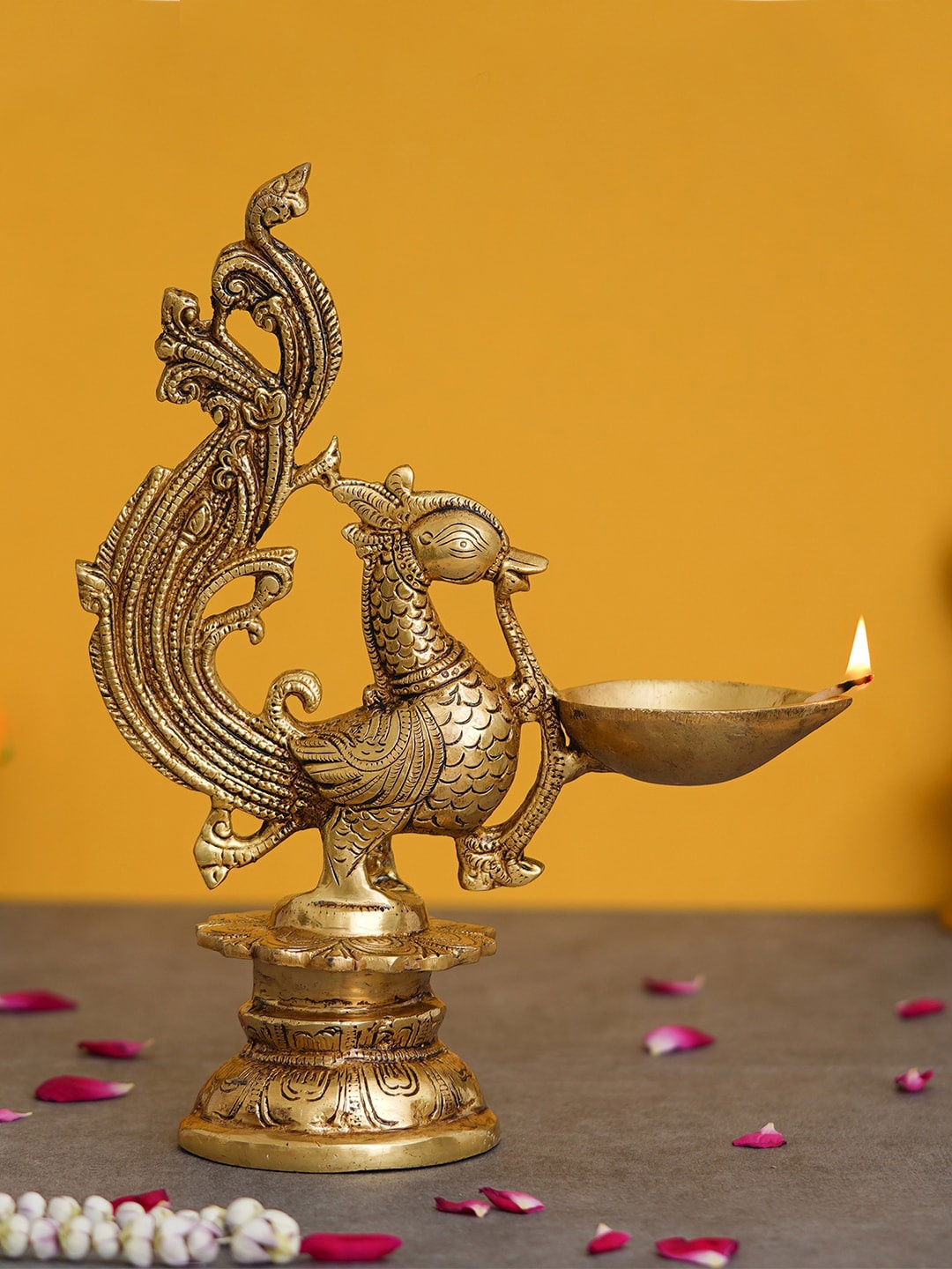 

eCraftIndia Gold Decorative Peacock Brass Showpiece with Diya Stand