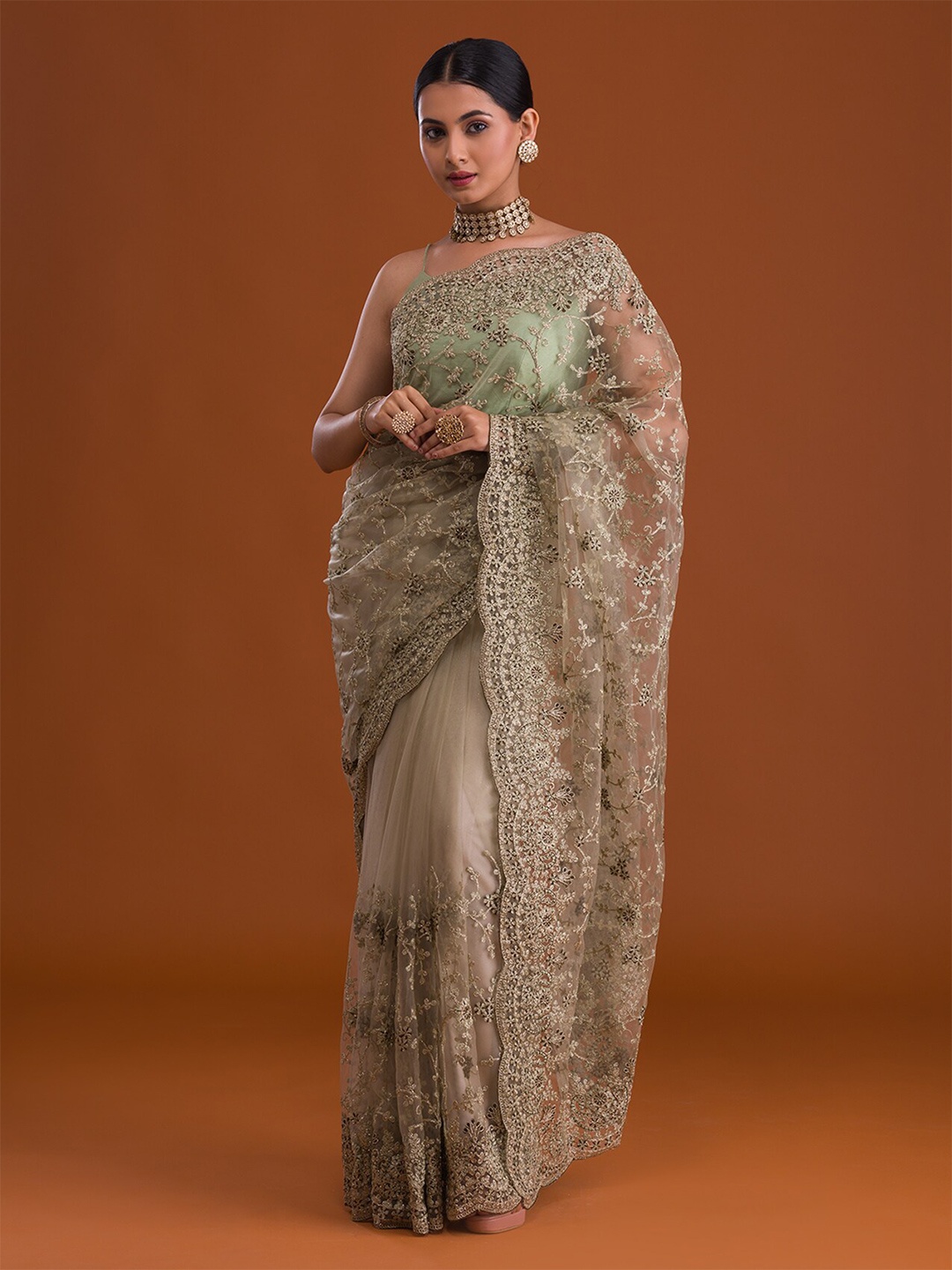 

Koskii Green & Gold-Toned Embellished Embroidered Net Heavy Work Saree
