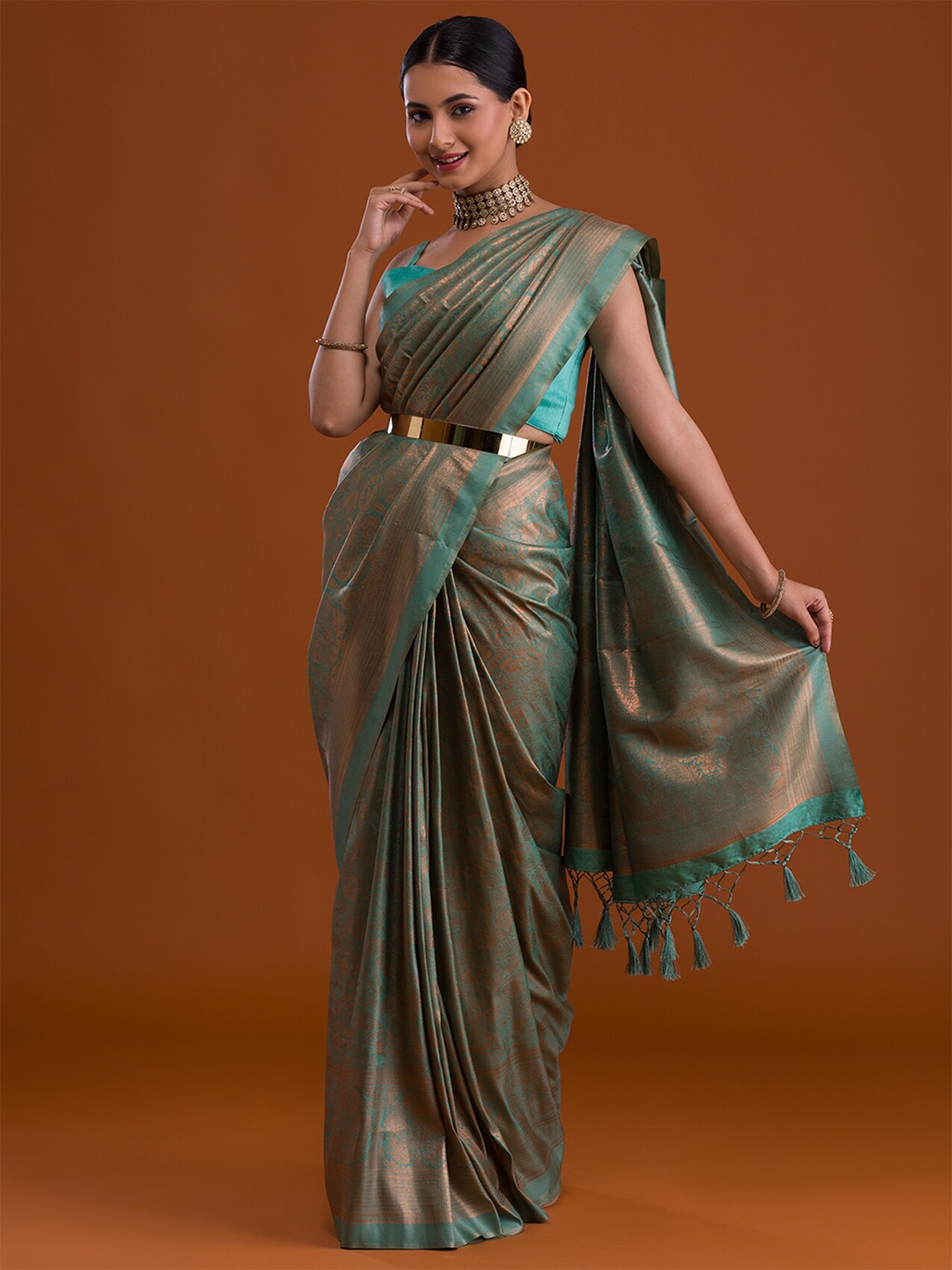 

Koskii Sea Green & Copper-Toned Ethnic Motifs Zari Brocade Saree