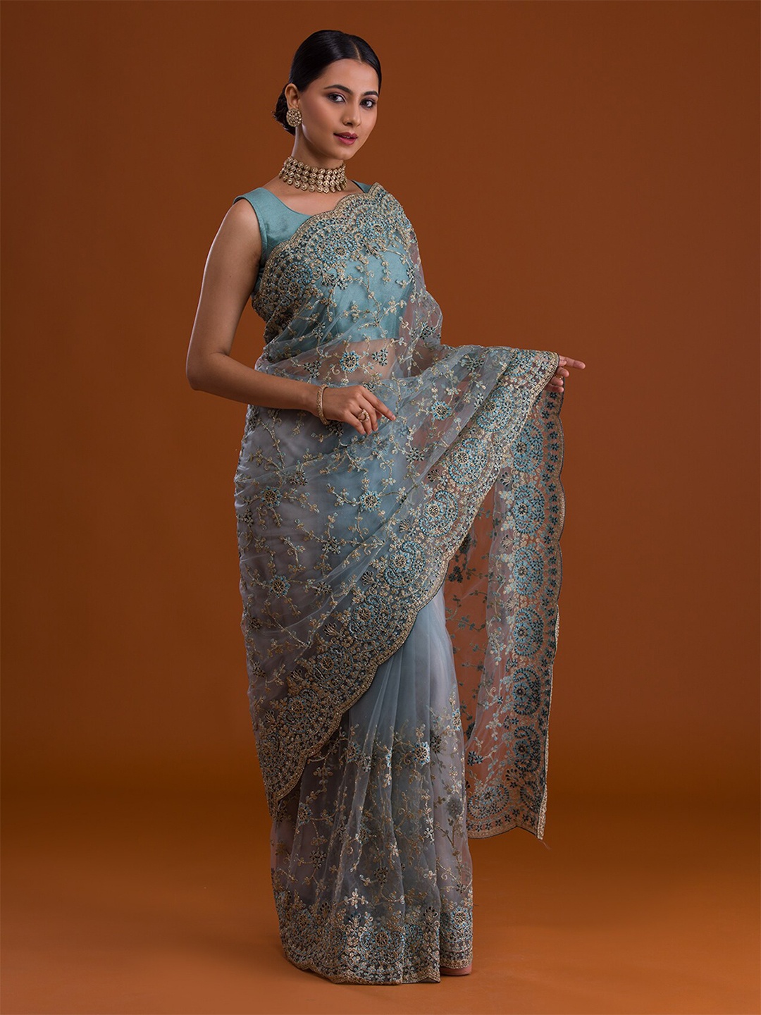

Koskii Turquoise Blue & Gold-Toned Floral Embroidered Net Heavy Work Saree