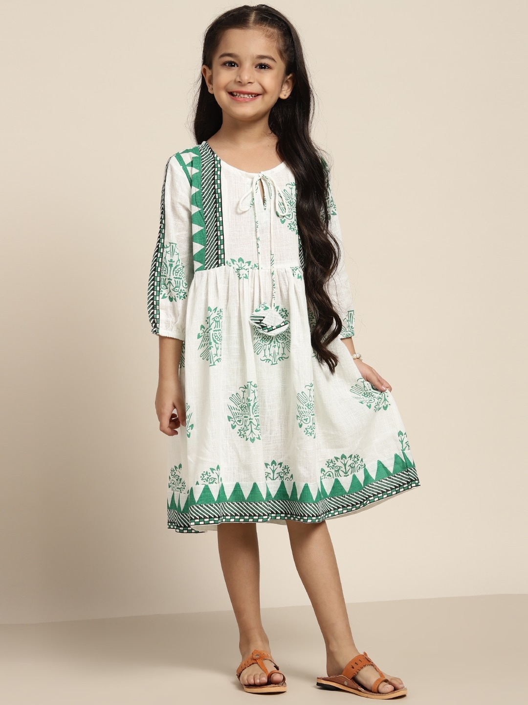 

Sangria White & Green Pure Cotton Ethnic Motifs Tie-Up Neck Dress