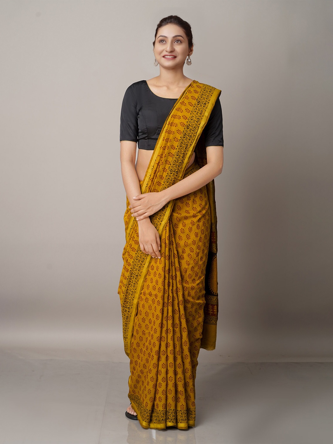 

Unnati Silks Rust & Black Floral Zari Chanderi Saree