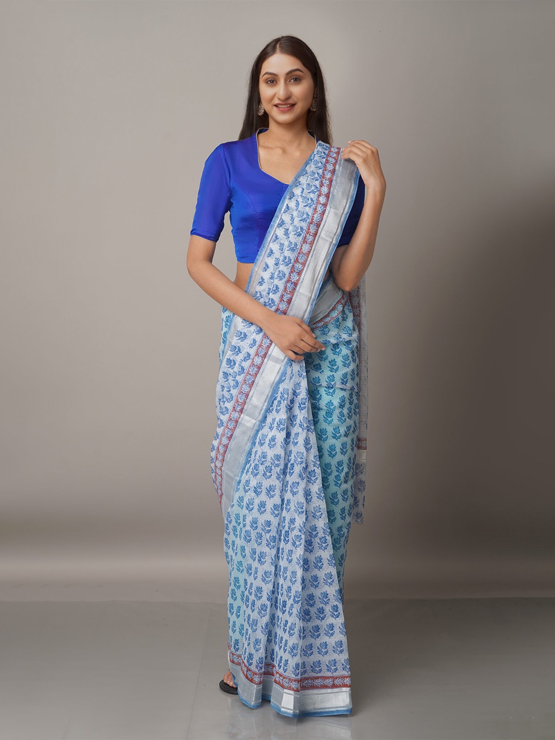 

Unnati Silks Blue & Silver-Toned Ethnic Motifs Zari Pure Cotton Kota Saree