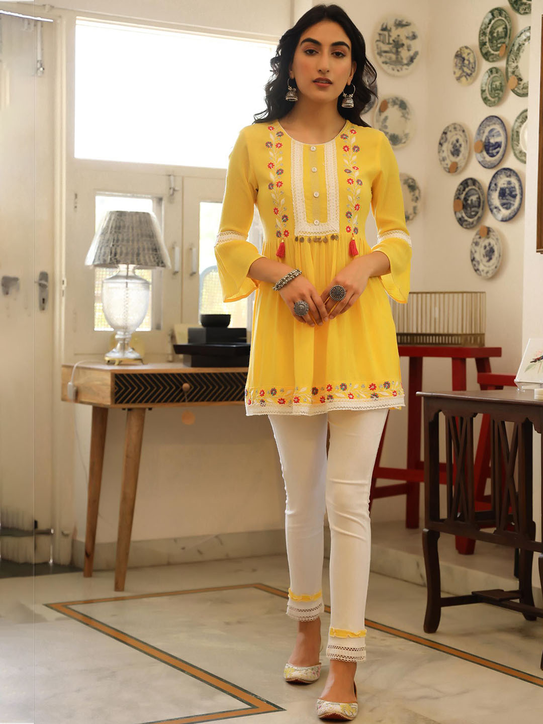 

SCAKHI Women Mustard Yellow Floral Embroidered Kurti with Trousers