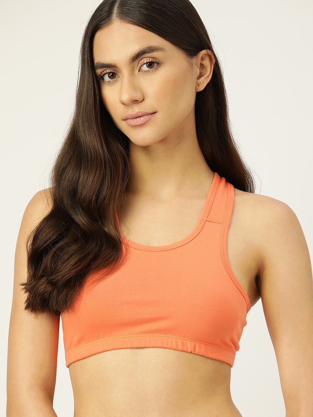 

DressBerry Orange Solid Sports Bra