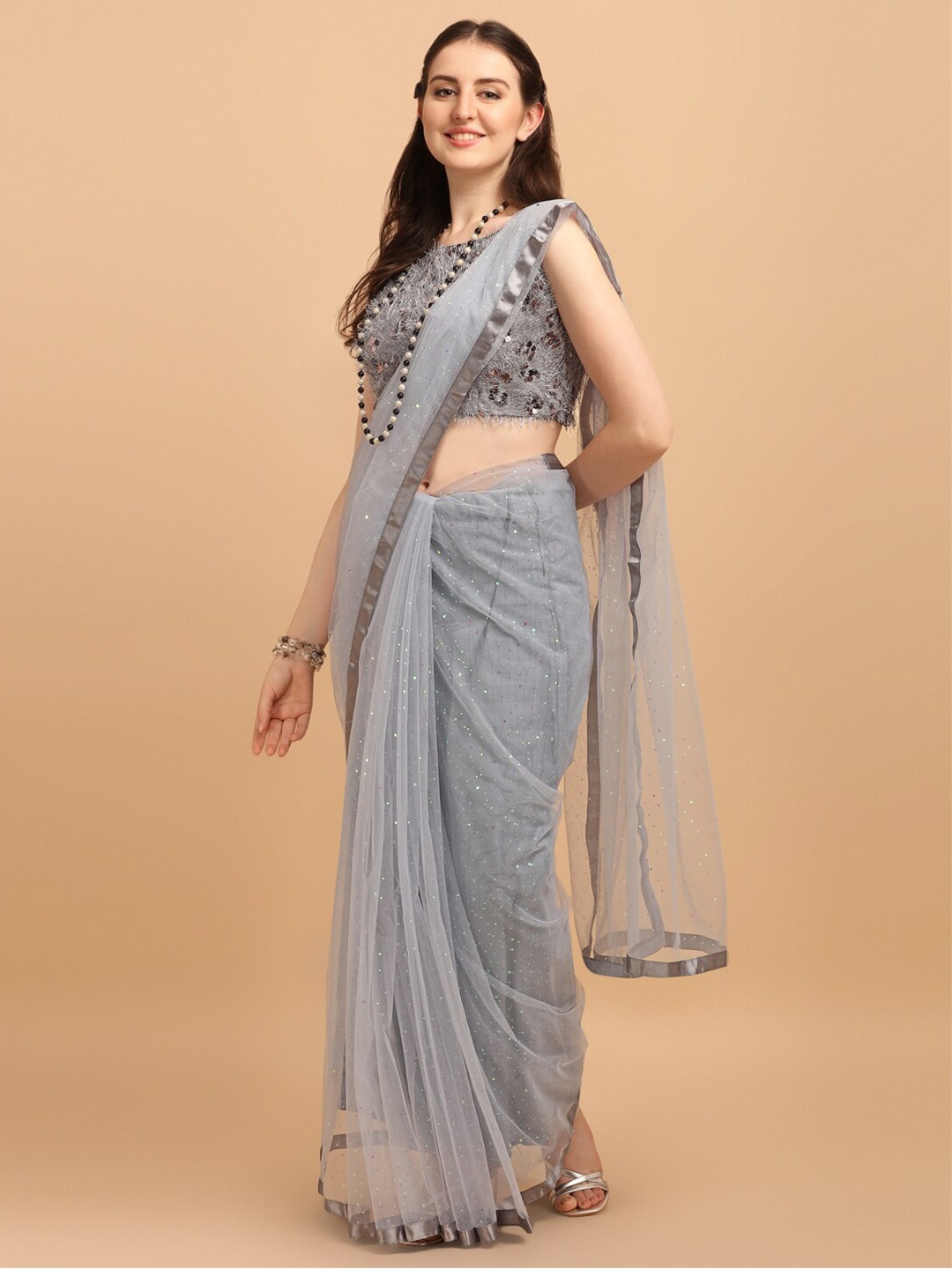 

Fab Viva Grey Embellished Net Saree With Sequences Blouse Piece