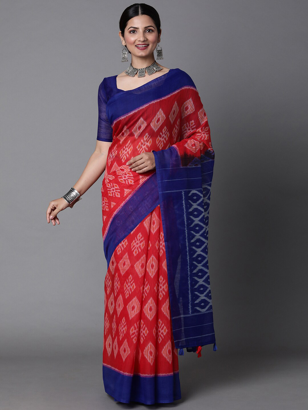

Mitera Red & Blue Ethnic Motifs Silk Cotton Ikat Saree with Matching Blouse
