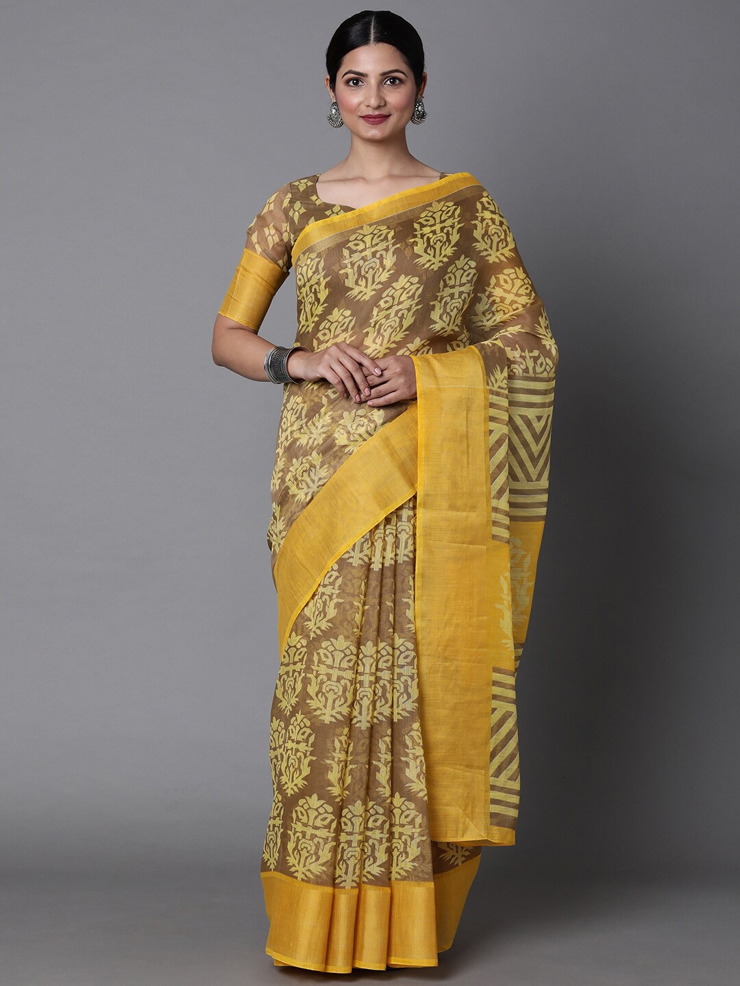

Mitera Yellow & Brown Ethnic Motifs Printed Silk Cotton Muga Saree