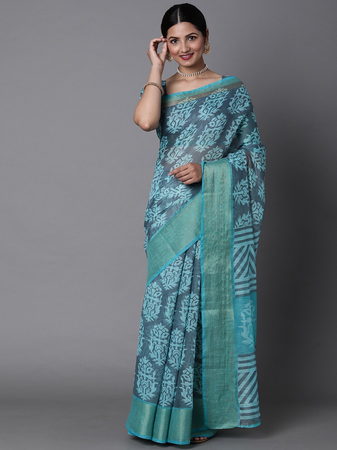 

Mitera Sea Green & Silver-Toned Ethnic Motifs Printed Silk Cotton Muga Saree