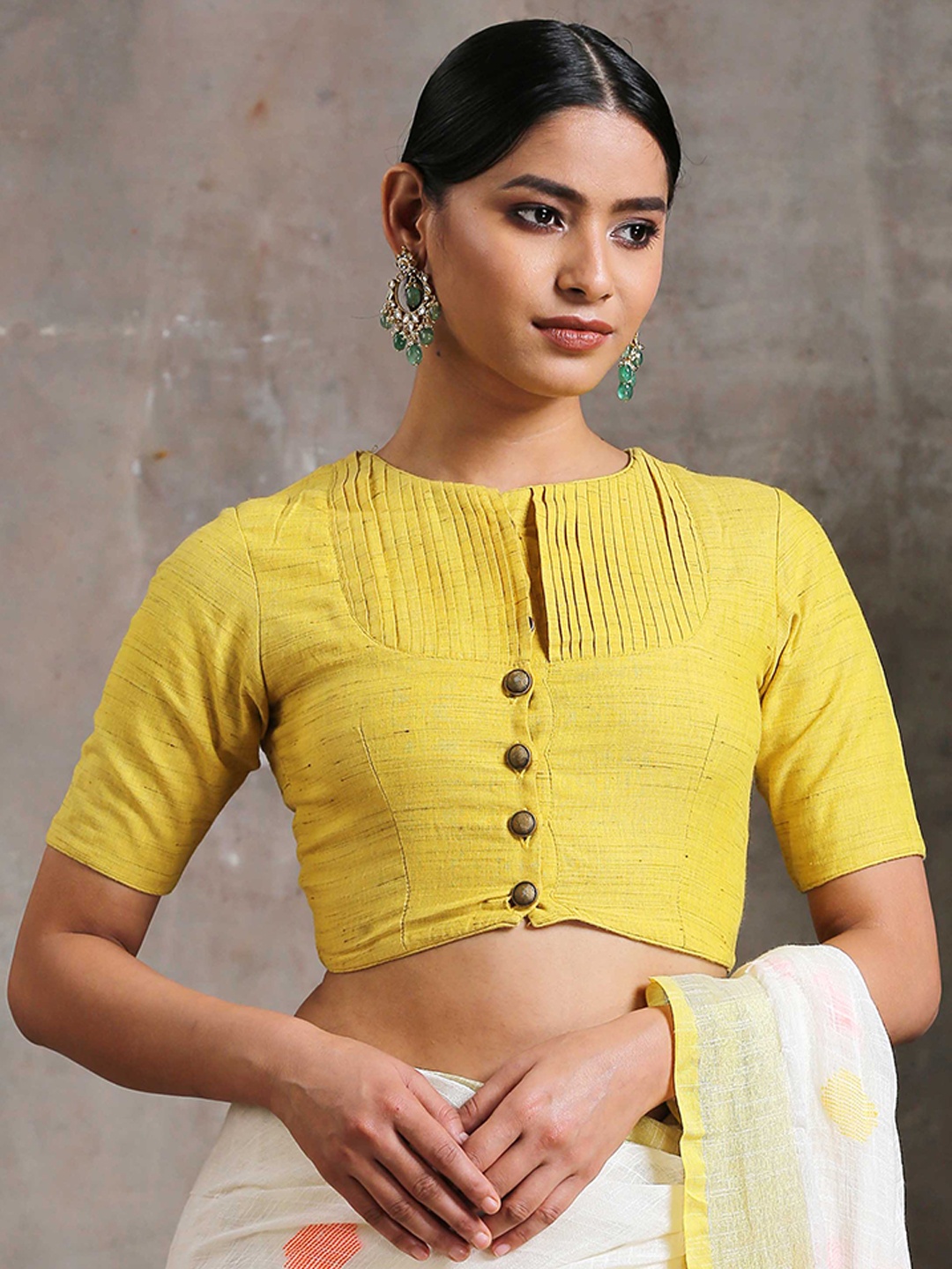 

Triyah Yellow Solid Pintuck Cotton Round Neck Blouse