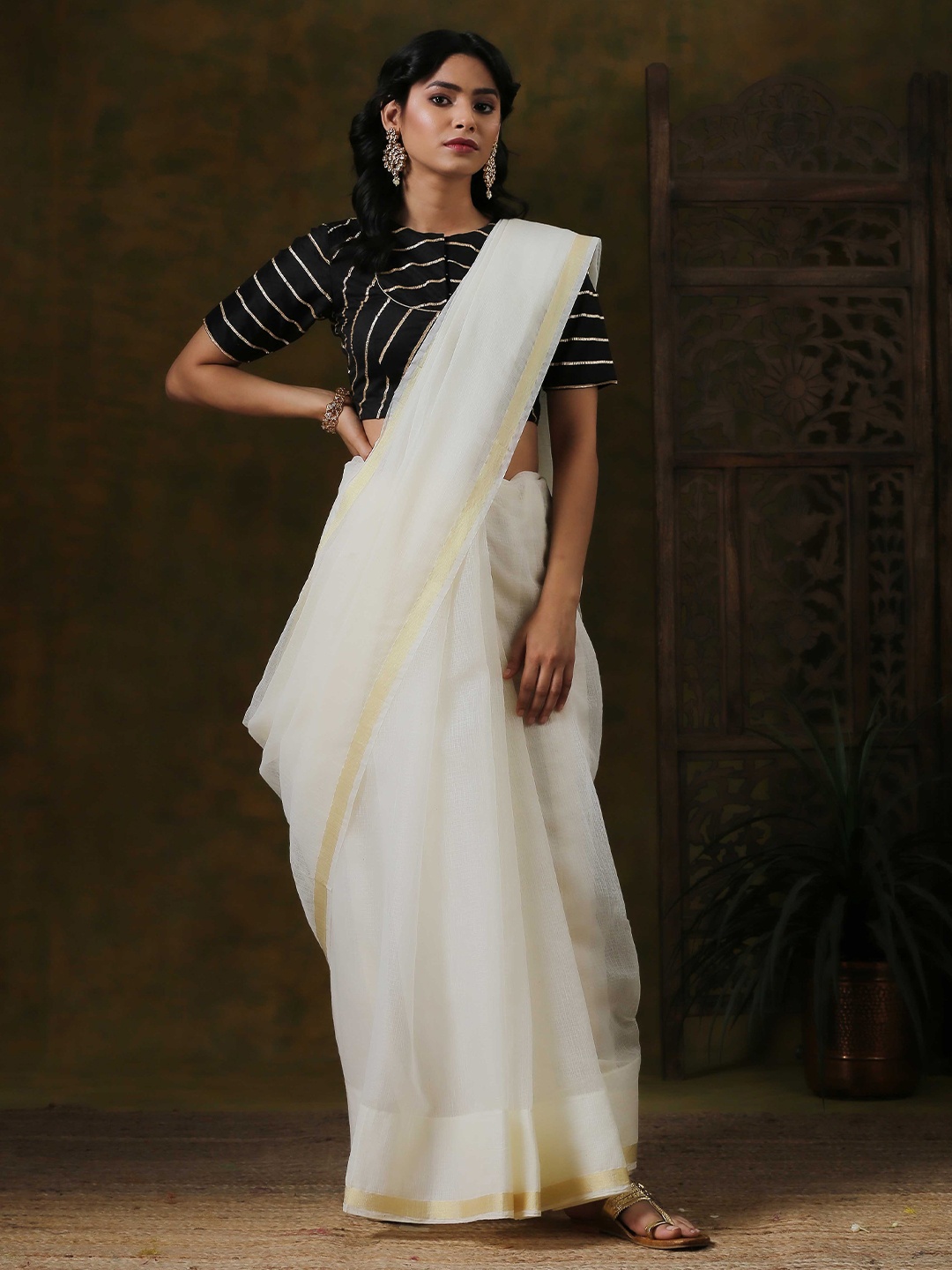 

Triyah Cream & Gold Solid Pure Cotton Zari Kota Saree
