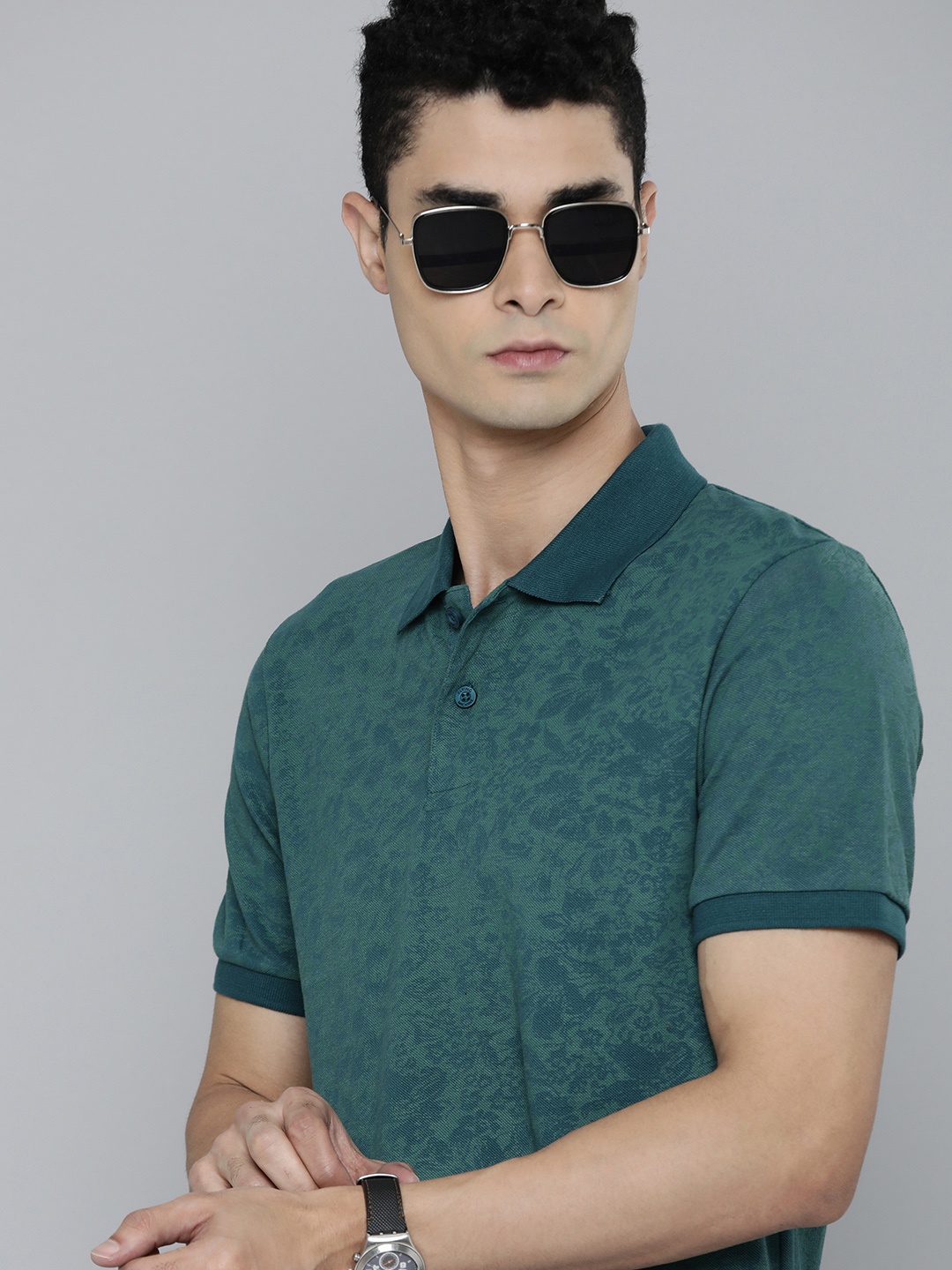 

Flying Machine Men Teal Blue & Green Floral Print Polo Collar Pure Cotton T-shirt