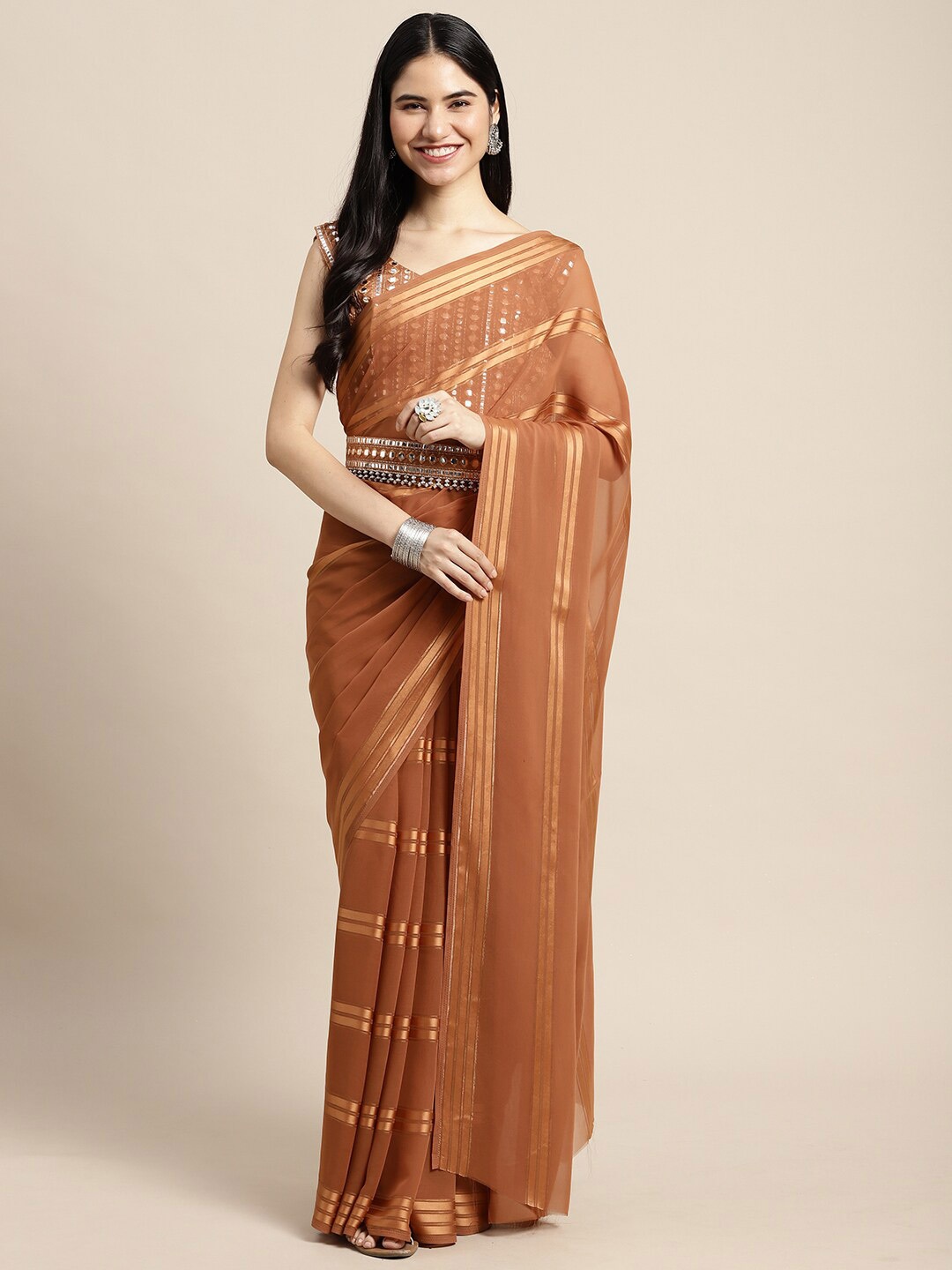 

Saree mall Women Beige & Gold Poly Georgette Striped Sarees