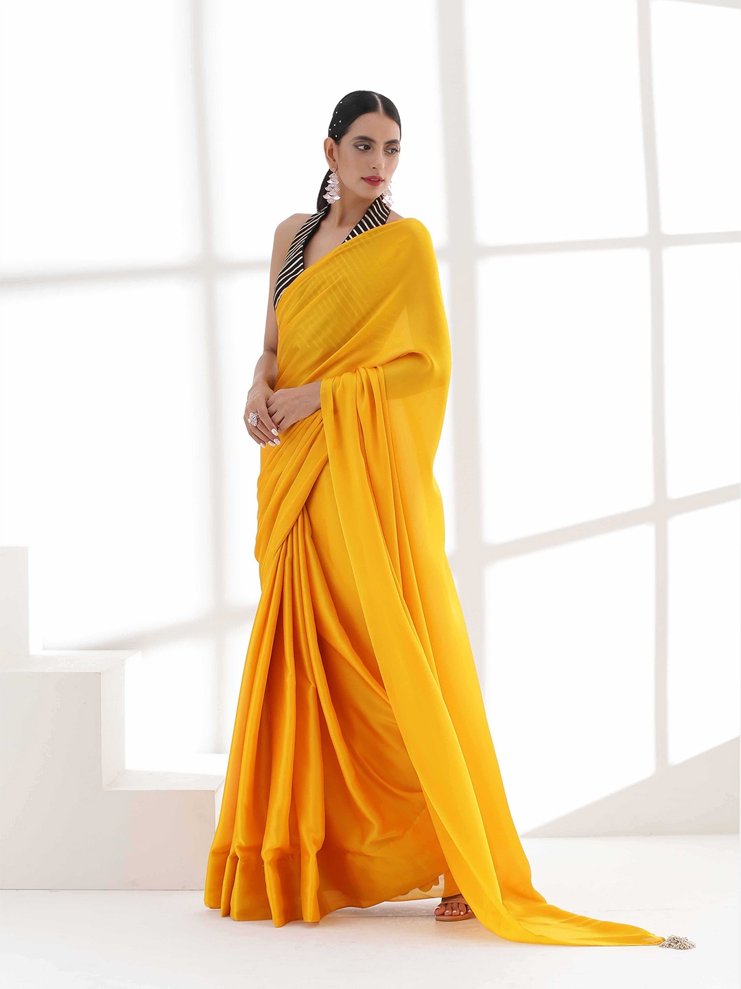 

Swtantra Yellow Solid Satin Saree