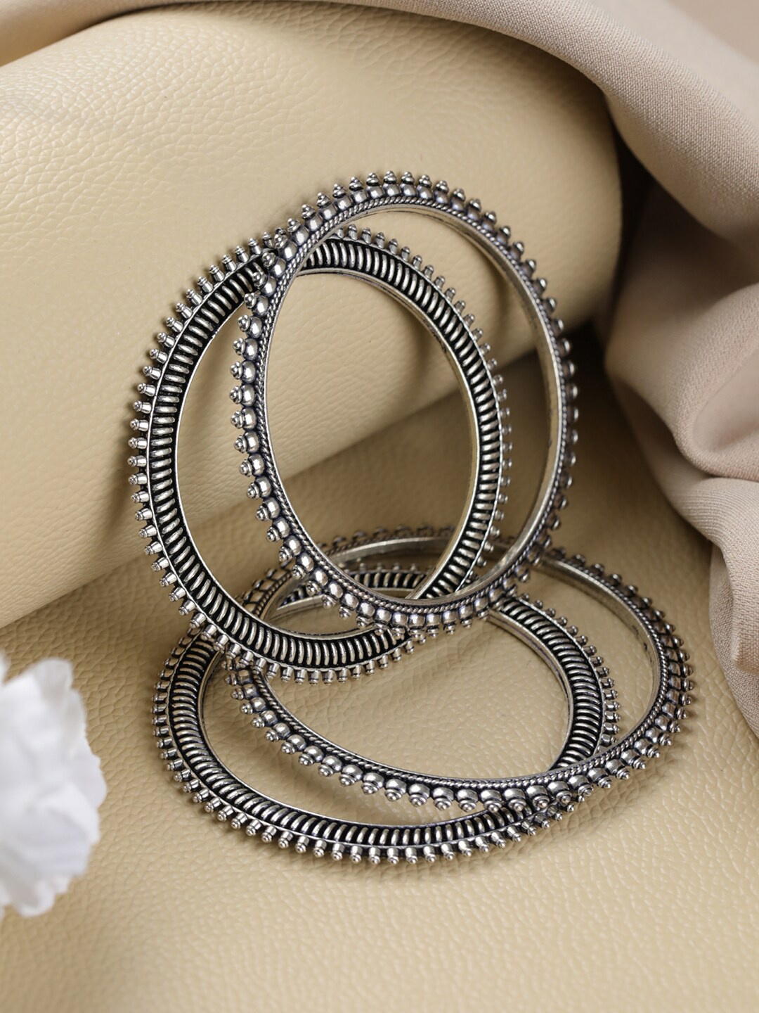 

Jazz and Sizzle Set Of 4 Silver Plated Oxidised Bangles