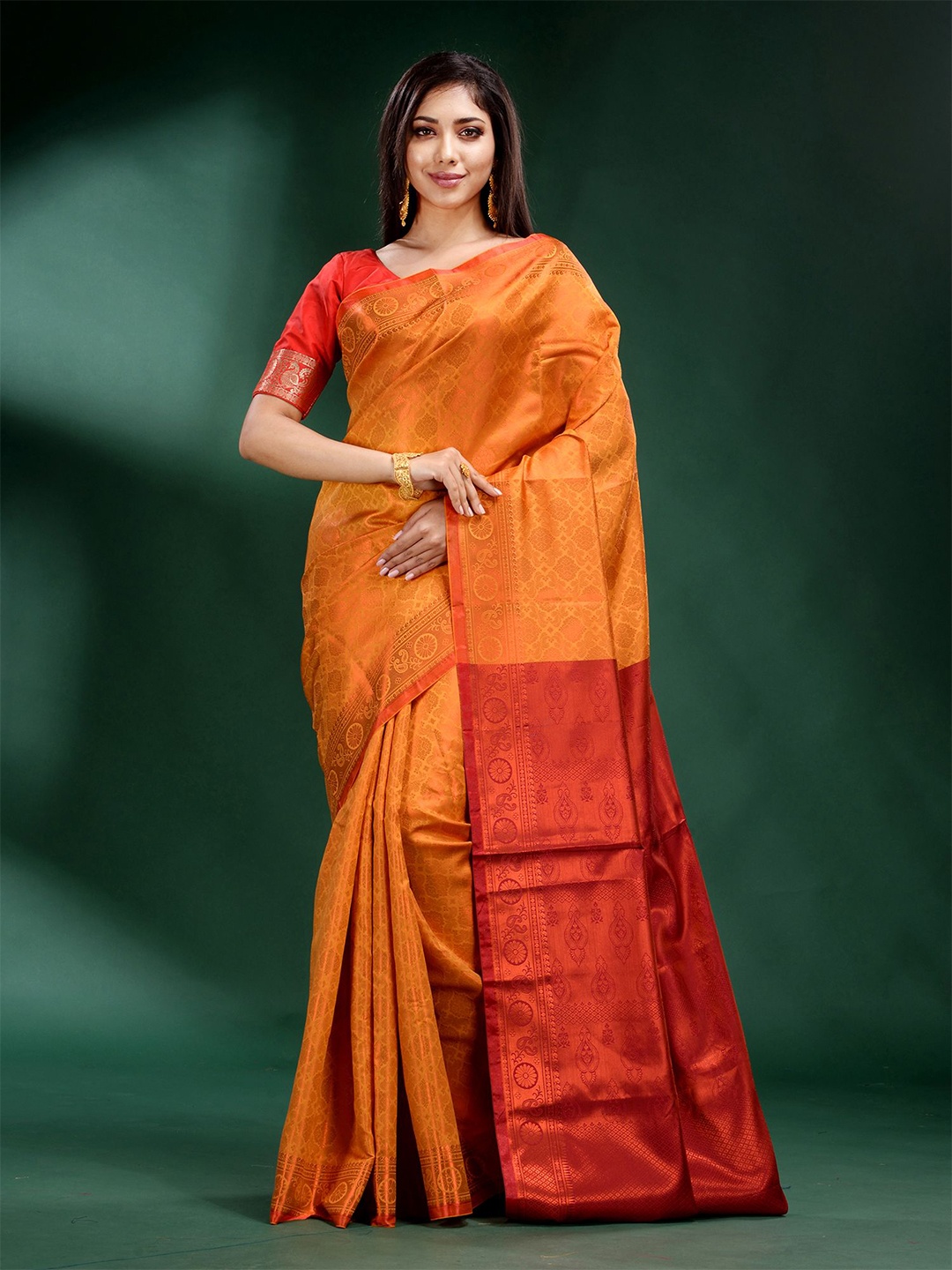 

Charukriti Mustard & Red Ethnic Motifs Zari Silk Blend Saree