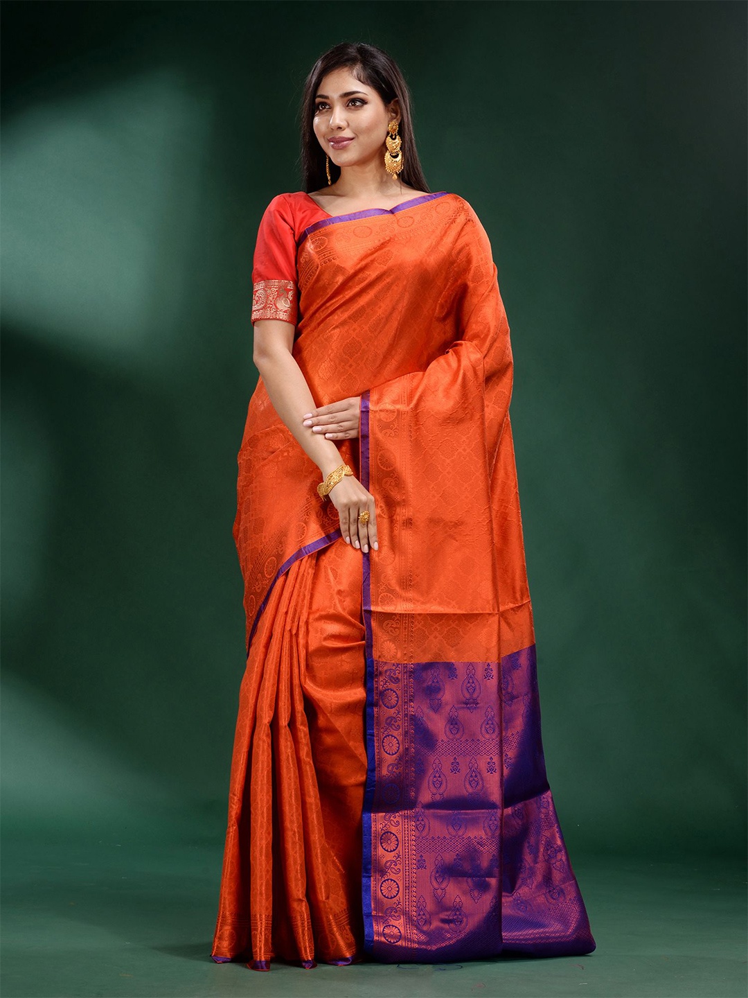 

Charukriti Orange & Blue Ethnic Motifs Zari Silk Blend Saree