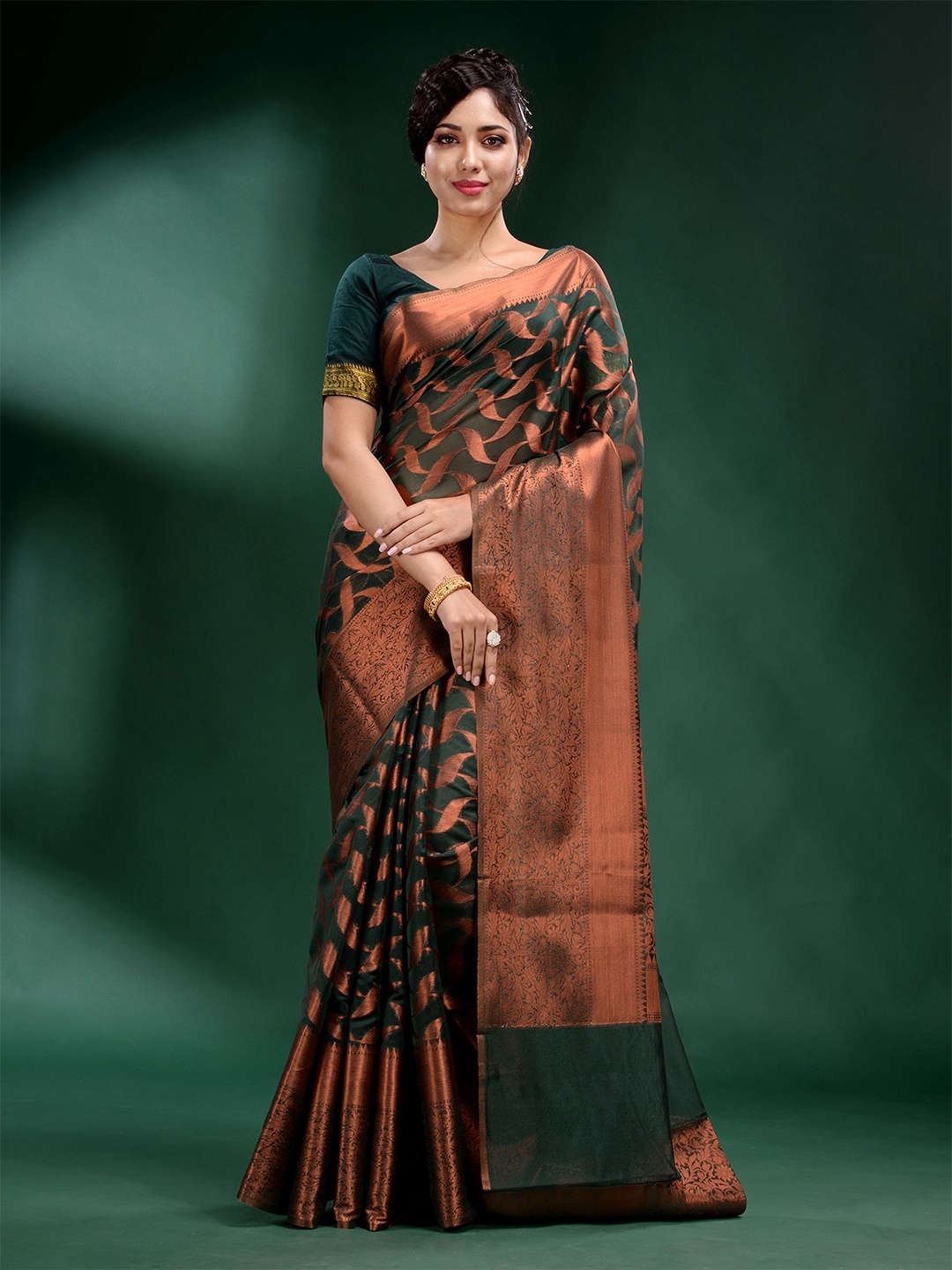 

Charukriti Green And Gold Toned Woven Design Zari Organza Saree