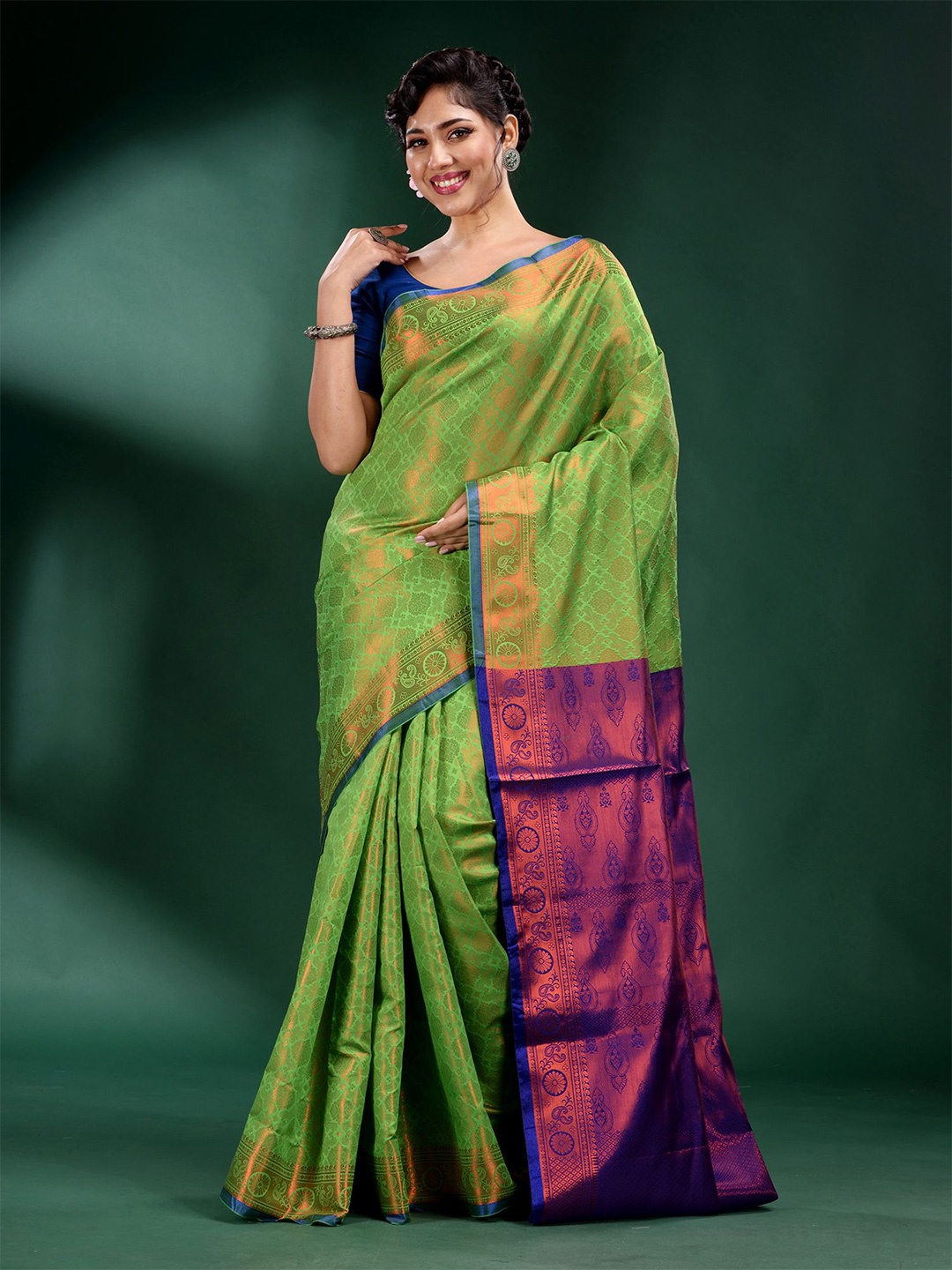 

Charukriti Green & Purple Ethnic Motifs Zari Silk Blend Saree