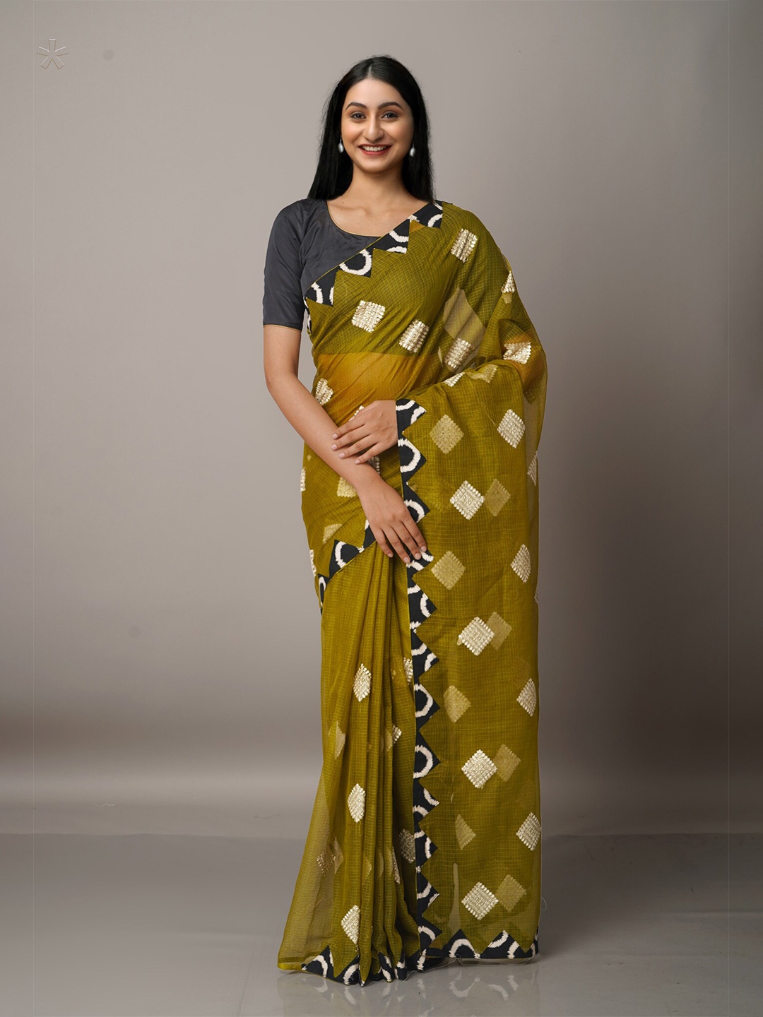 

Unnati Silks Green & Black Supernet Patola Saree