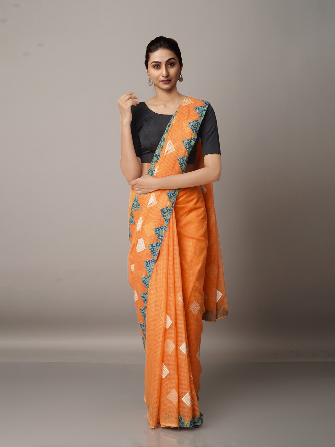 

Unnati Silks Orange & Off White Ethnic Motifs Supernet Patola Saree