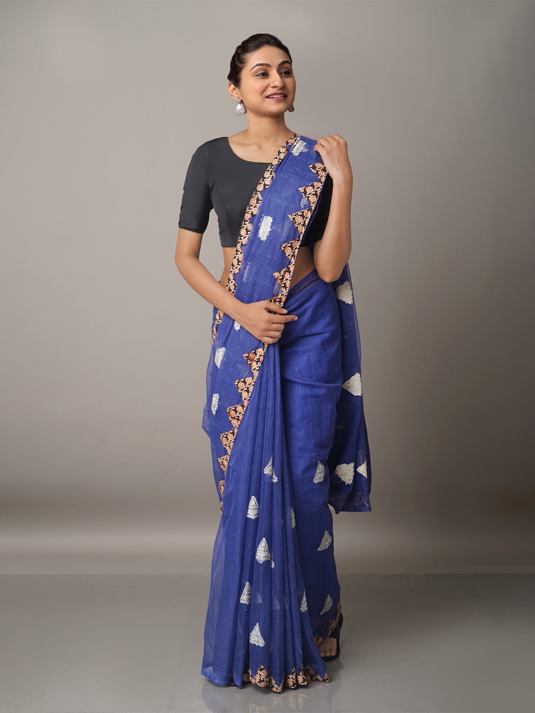 

Unnati Silks Blue & Silver-Toned Ethnic Motifs Embroidered Supernet Patola Saree