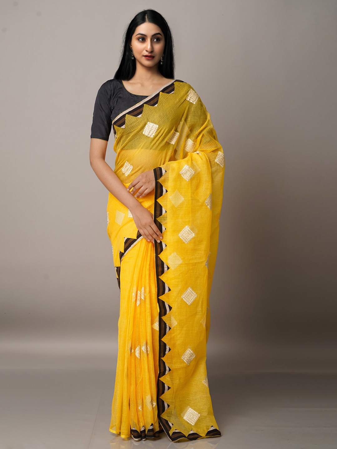 

Unnati Silks Yellow & White Patchwork Supernet Patola Saree