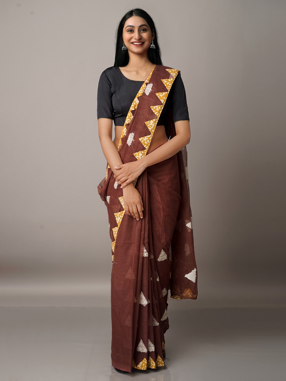 

Unnati Silks Brown & White Patchwork Supernet Patola Saree