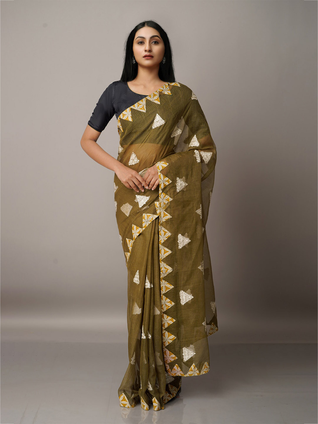 

Unnati Silks Green & Mustard Ethnic Motifs Patchwork Supernet Patola Saree