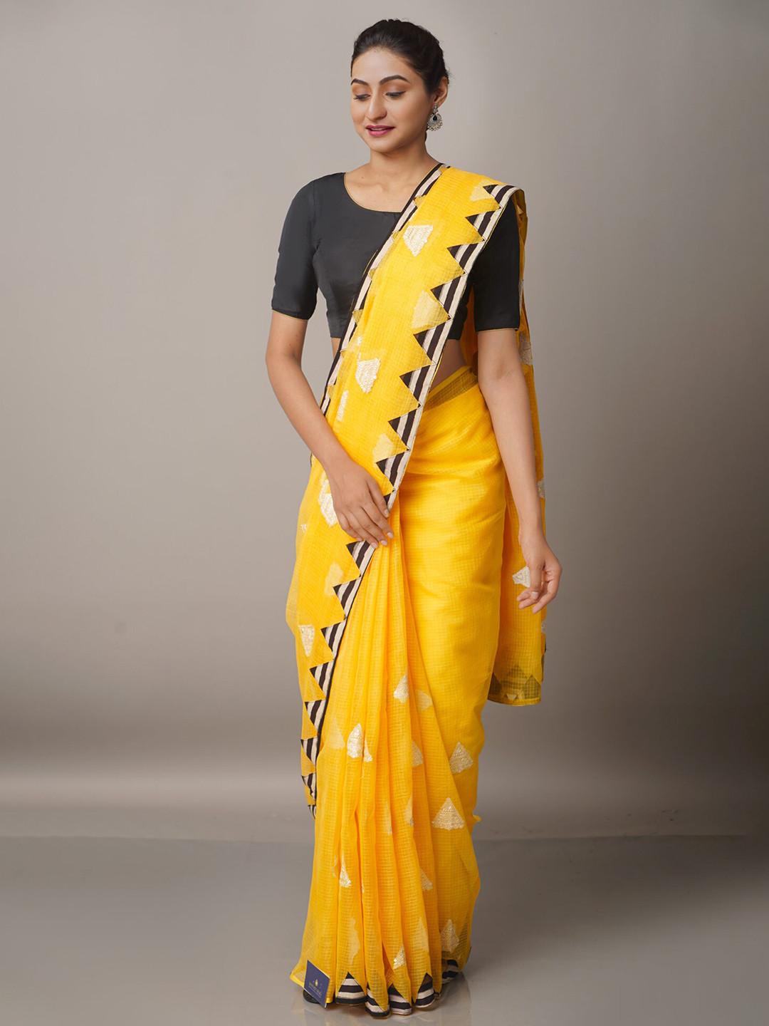 

Unnati Silks Yellow & Off White Checked Embroidered Supernet Patola Saree
