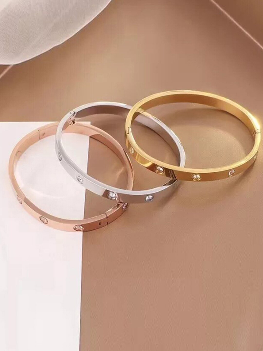 

Jewels Galaxy Women Set of 3 Silver-Plated & Gold-Plated AD Bangle Style Bracelet