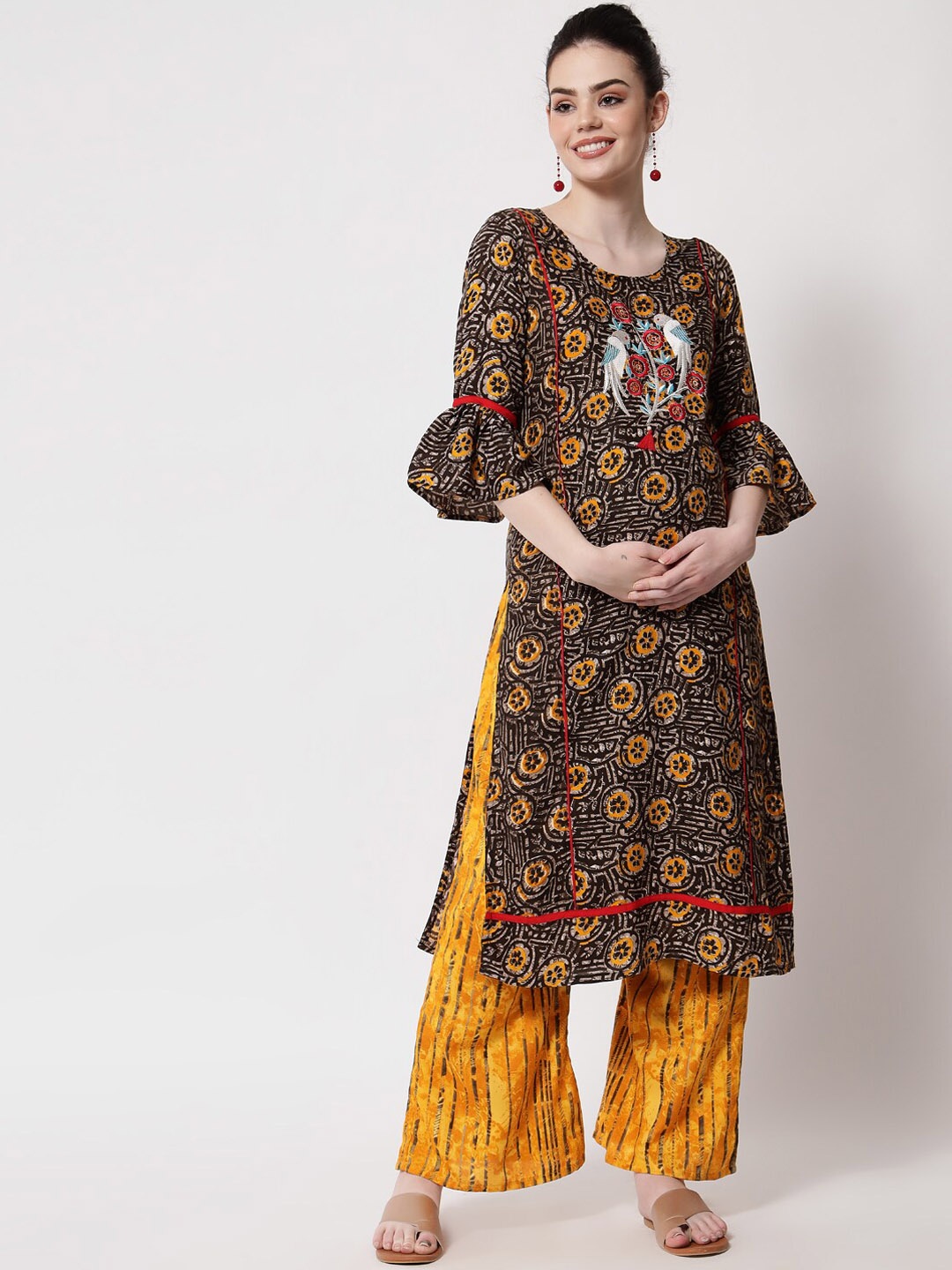 

Aujjessa Women Black Ethnic Motifs Printed Thread Work Kurta with Palazzos